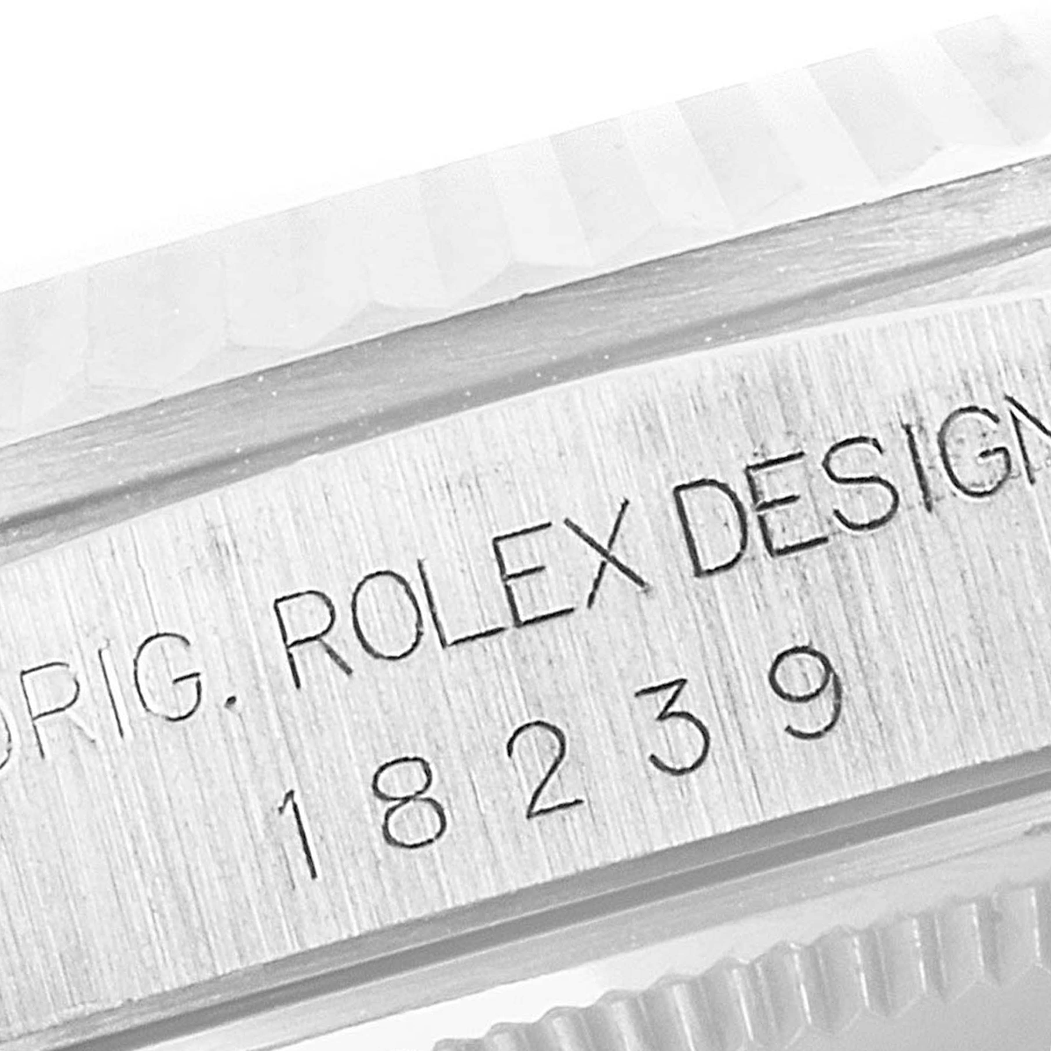 This image shows a close-up of the serial number and branded engraving on the side of the Rolex President 18239 Men's White Gold Silver Dial 18239 Men's White Gold Silver Dial model watch.
