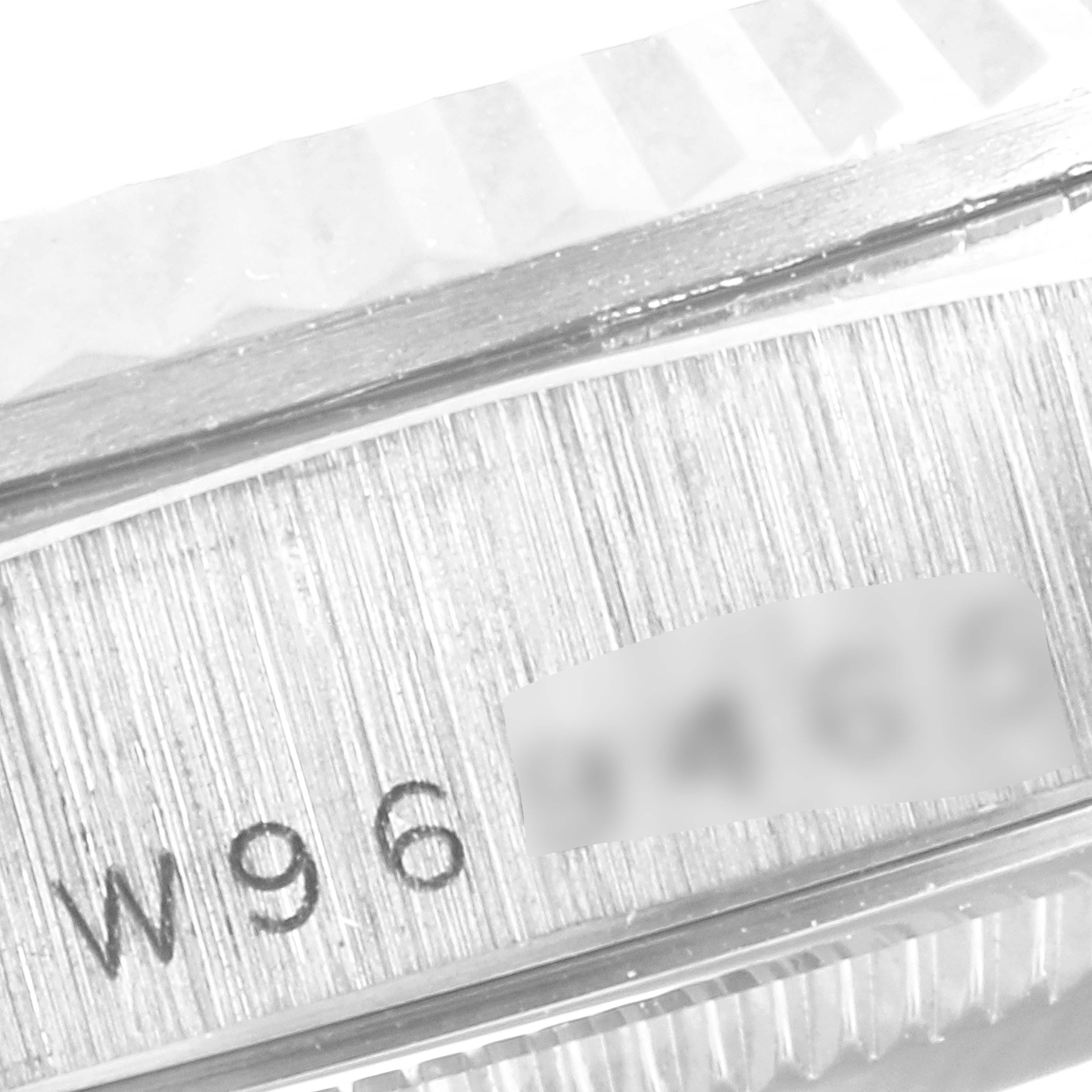 The image shows a close-up of the Rolex President 18239 Men's White Gold Silver Dial 18239 Men's White Gold Silver Dial watch, focusing on the serial number engraved on the case side.