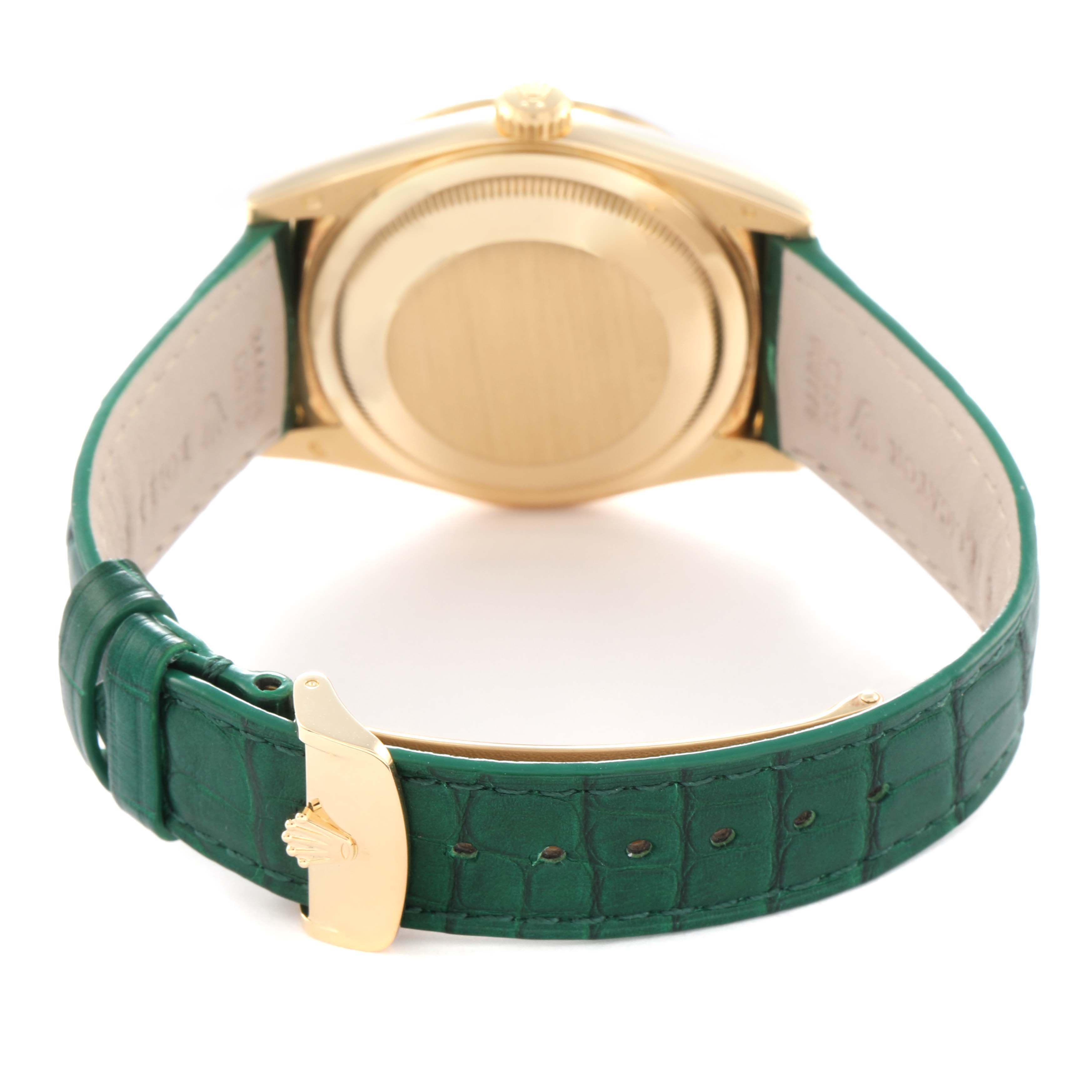 The image shows the back of a Rolex President model 118138 men's watch, highlighting the gold case and green leather strap with a gold clasp.