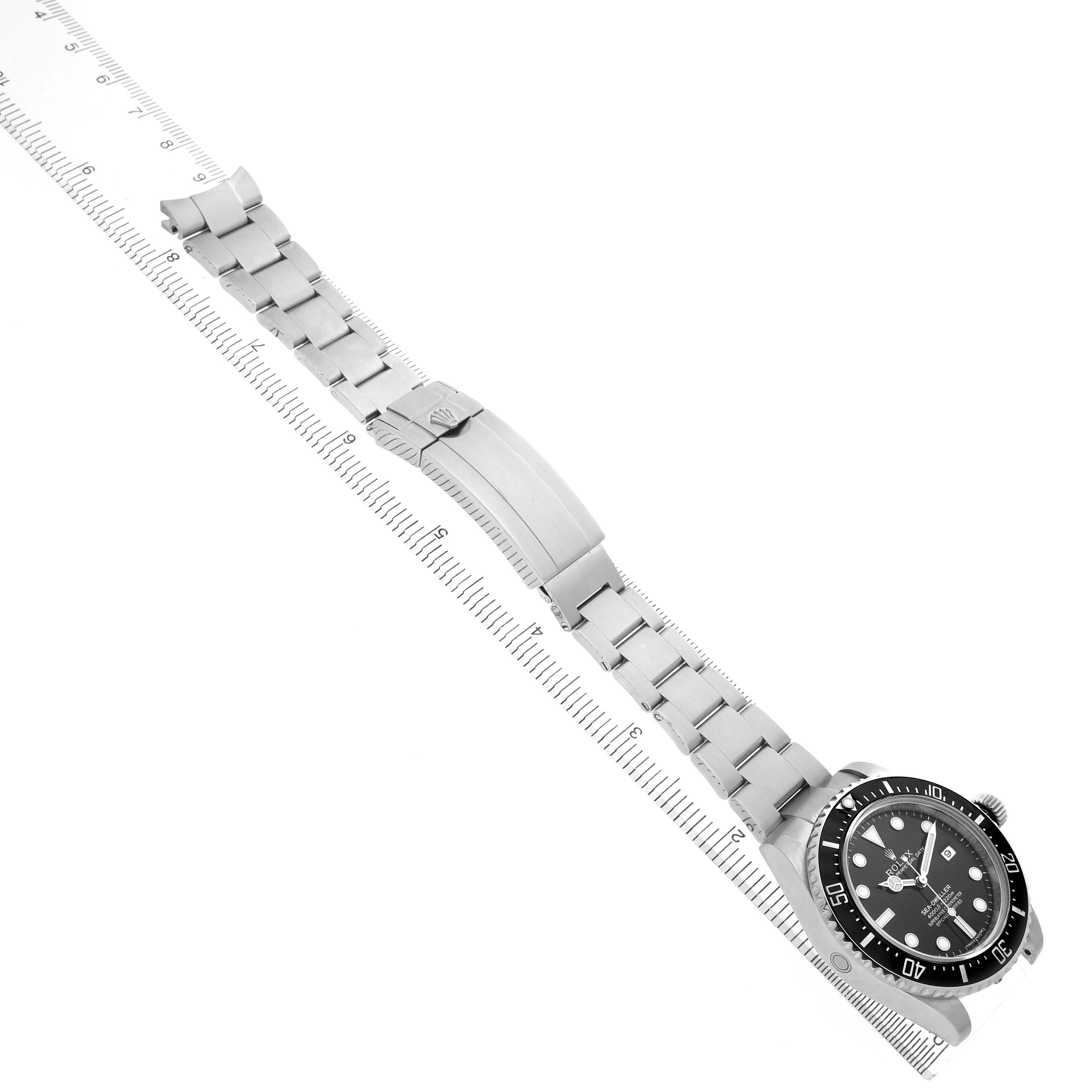 The Rolex Sea-Dweller 116600 Men's Stainless Steel Black Dial watch is shown diagonally with the bracelet and clasp displayed fully extended.