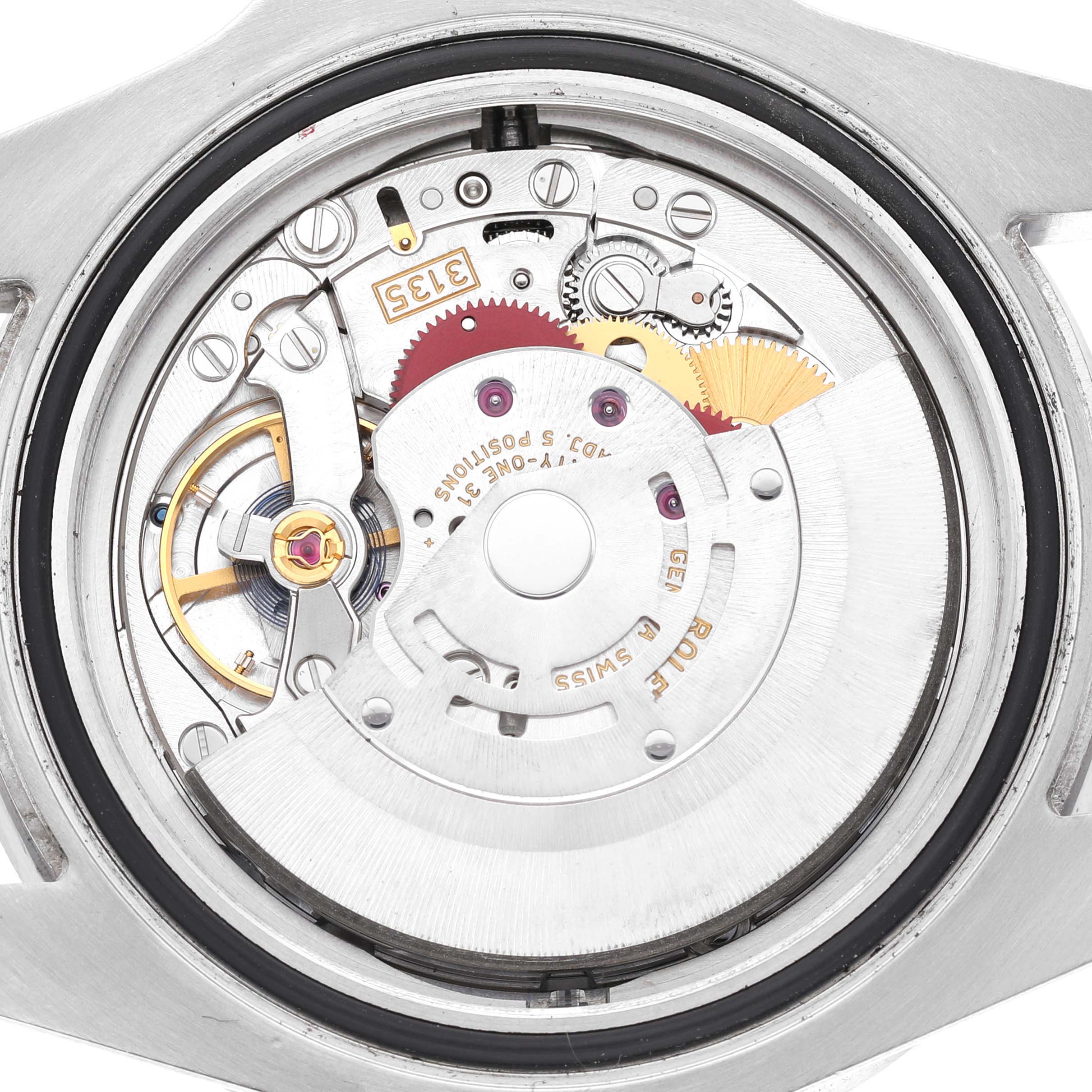 The image shows the intricate movement parts of a Rolex Sea-Dweller 116600 Men's Stainless Steel Black Dial model from a back angle, highlighting gears and mechanical components.