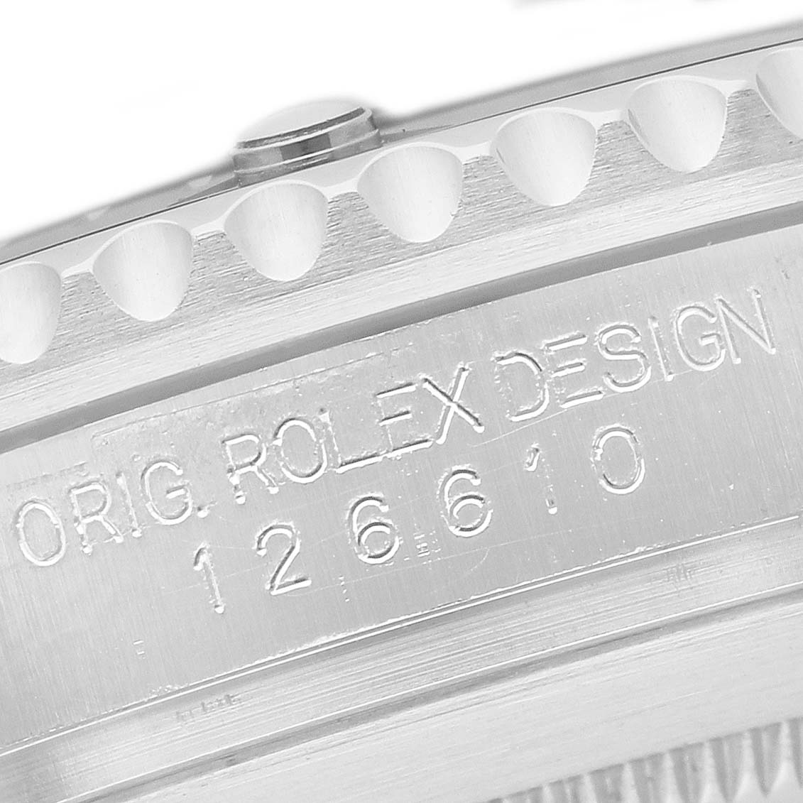 The image shows a close-up of the engraved side of a Rolex Submariner 126610LN Men's Stainless Steel Black Dial, displaying the model number.