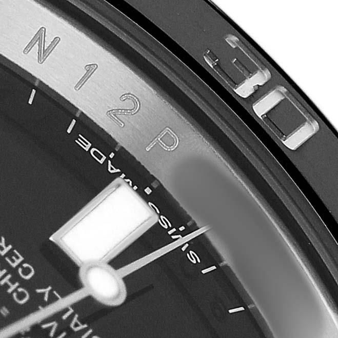The image shows a close-up of the bezel and dial of a Rolex Submariner M116610LN-0001 Men's Stainless Steel Black Dial, highlighting the 30-minute marker and part of the hour hand.