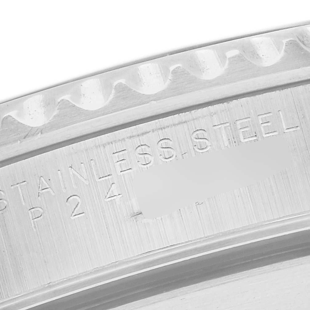 The image shows a close-up of the stainless steel casing with engraved text on the Rolex Submariner model 14060 men's watch.