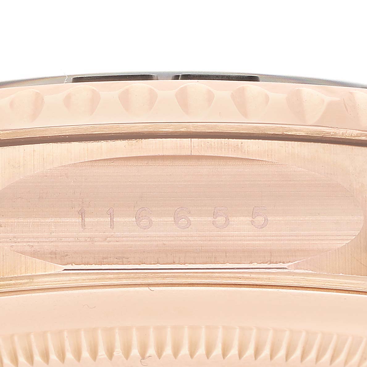 The image shows a close-up side view of the Rolex Yacht-Master 116655 Men's Rose Gold Black Dial case, focusing on the reference number engraving and bezel edge.