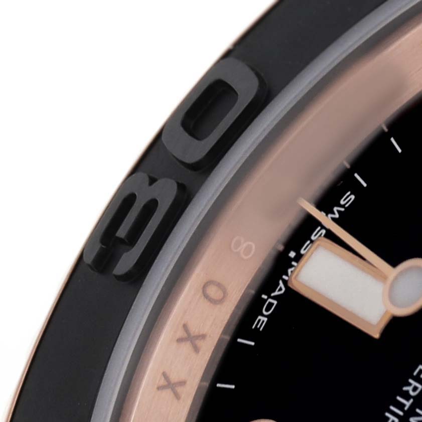 The image shows a close-up of the bezel and part of the dial of the Rolex Yacht-Master 116655 Men's Rose Gold Black Dial watch.
