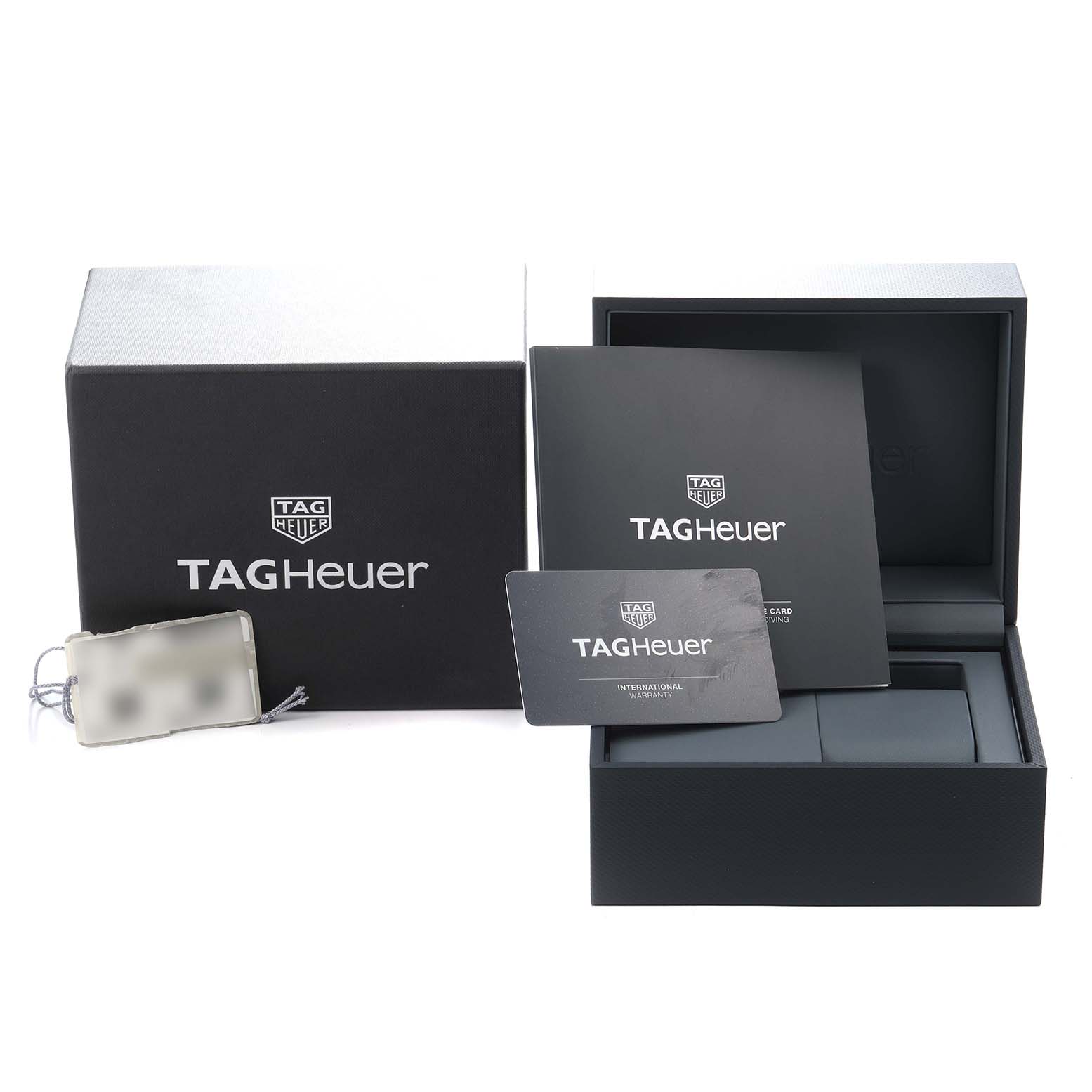 The image shows packaging and accessories for the TAG Heuer Aquaracer model WAY201F, including the box, manual, tag, and warranty card.