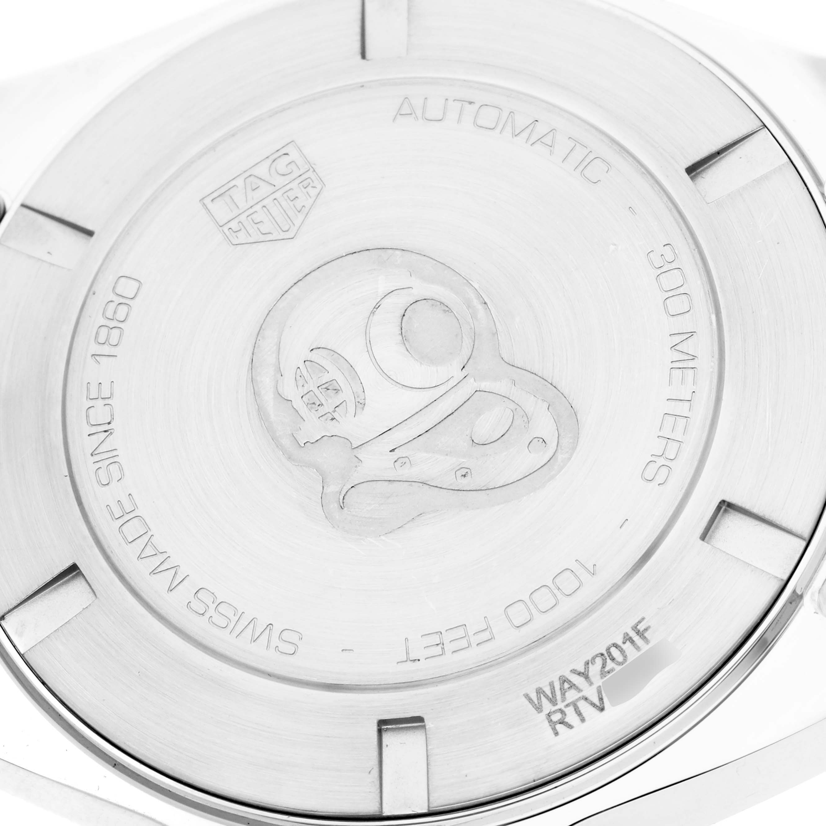 The image shows the back case of a Tag Heuer Aquaracer WAY201F men's watch, featuring engravings of water resistance depth and the brand's details.