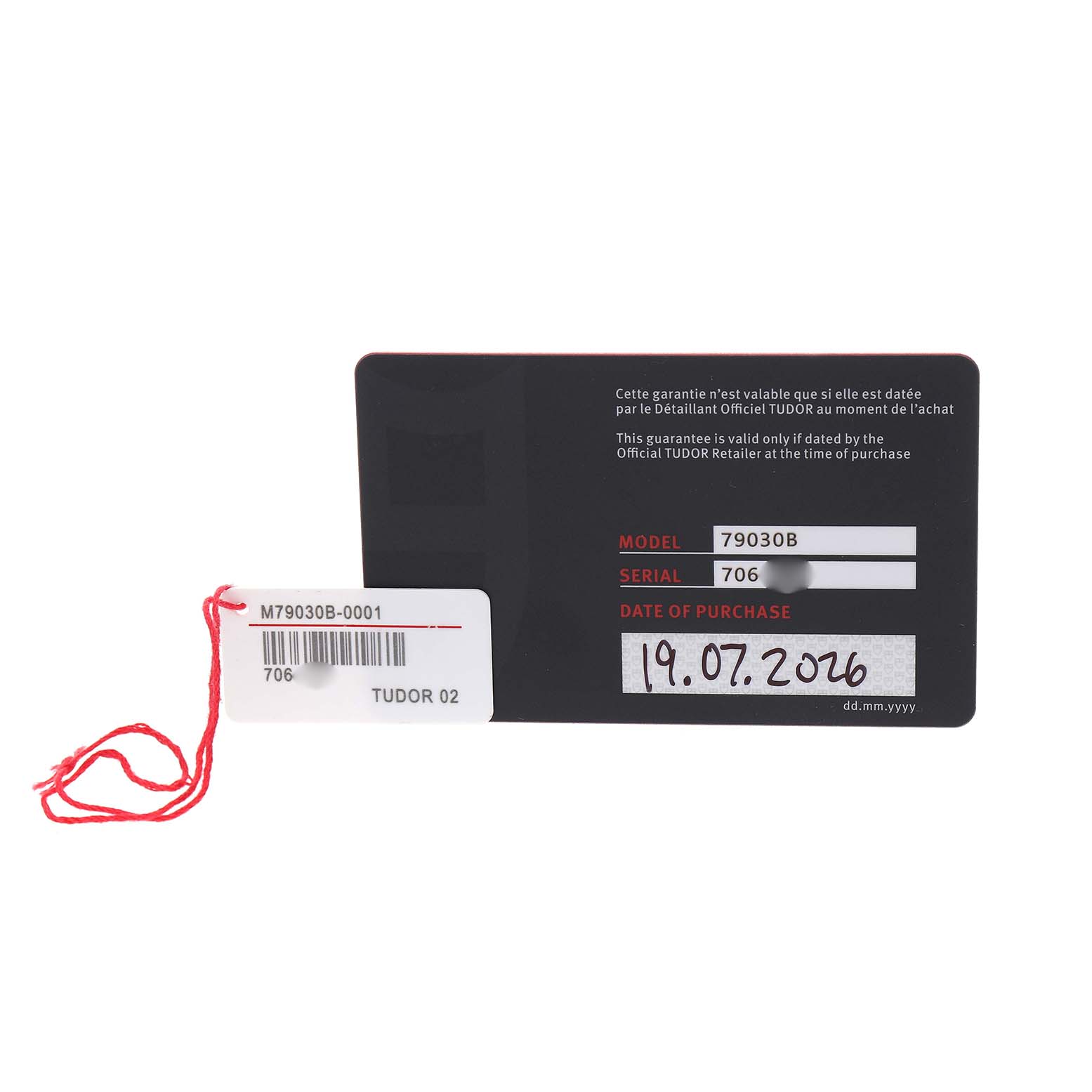 The image shows the warranty card and tag for the Tudor Heritage Black Bay 79030B Men's Stainless Steel Blue Dial model, featuring model and serial numbers.