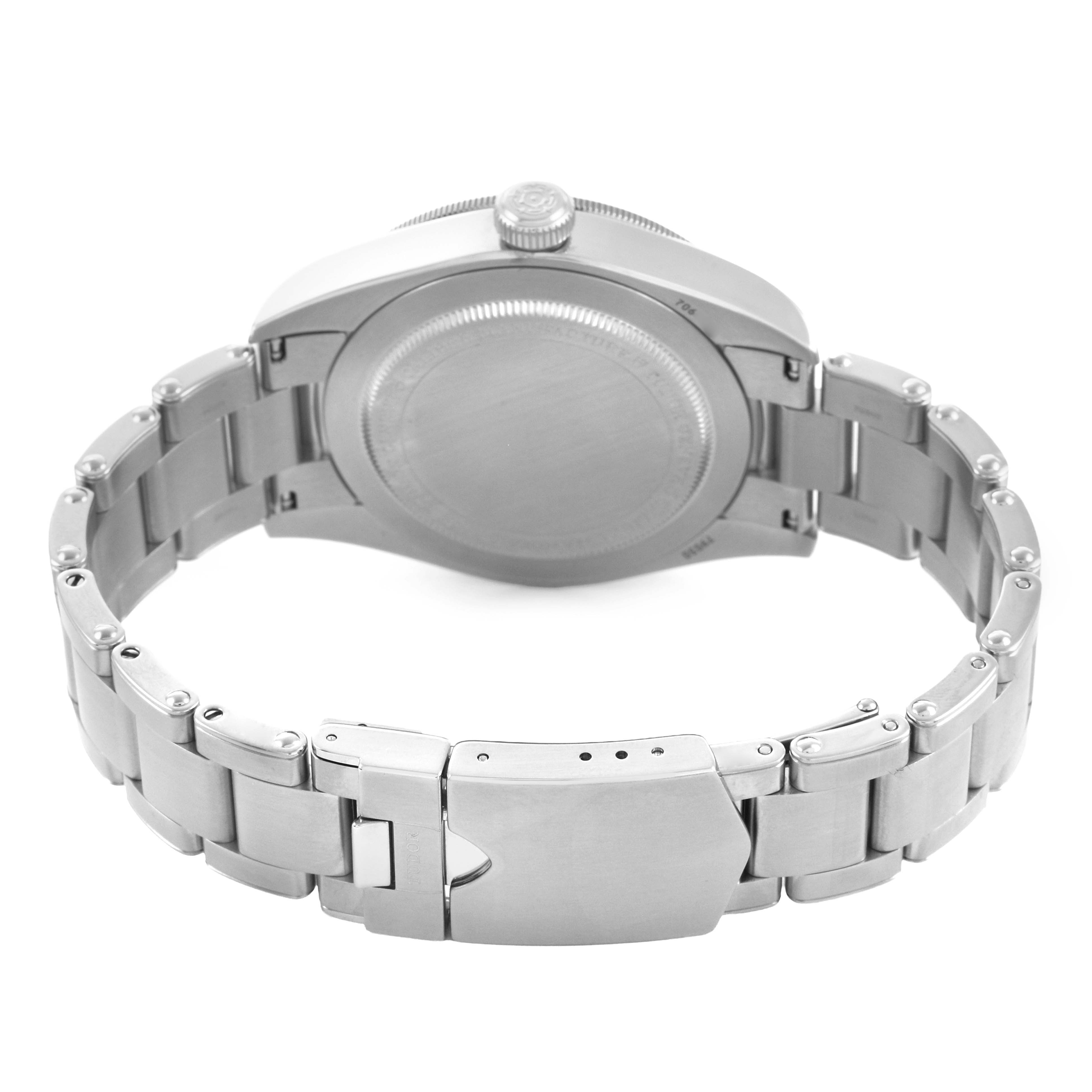 The image shows the rear view of the Tudor Heritage Black Bay 79030B Men's Stainless Steel Blue Dial watch, highlighting the case back, bracelet, and clasp.