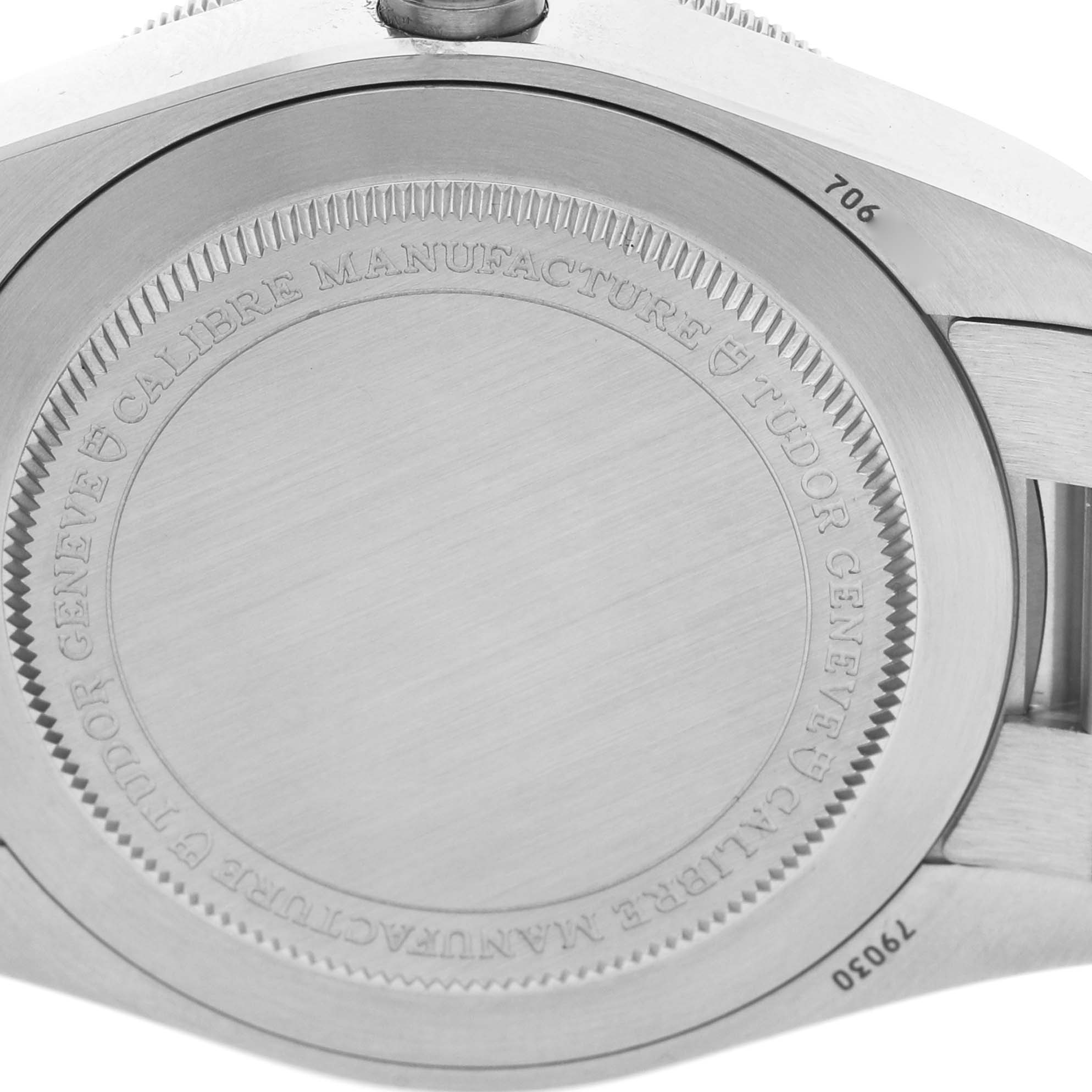 The image shows the case back of a Tudor Heritage Black Bay 79030B Men's Stainless Steel Blue Dial watch, focusing on the engraved details and side profile.