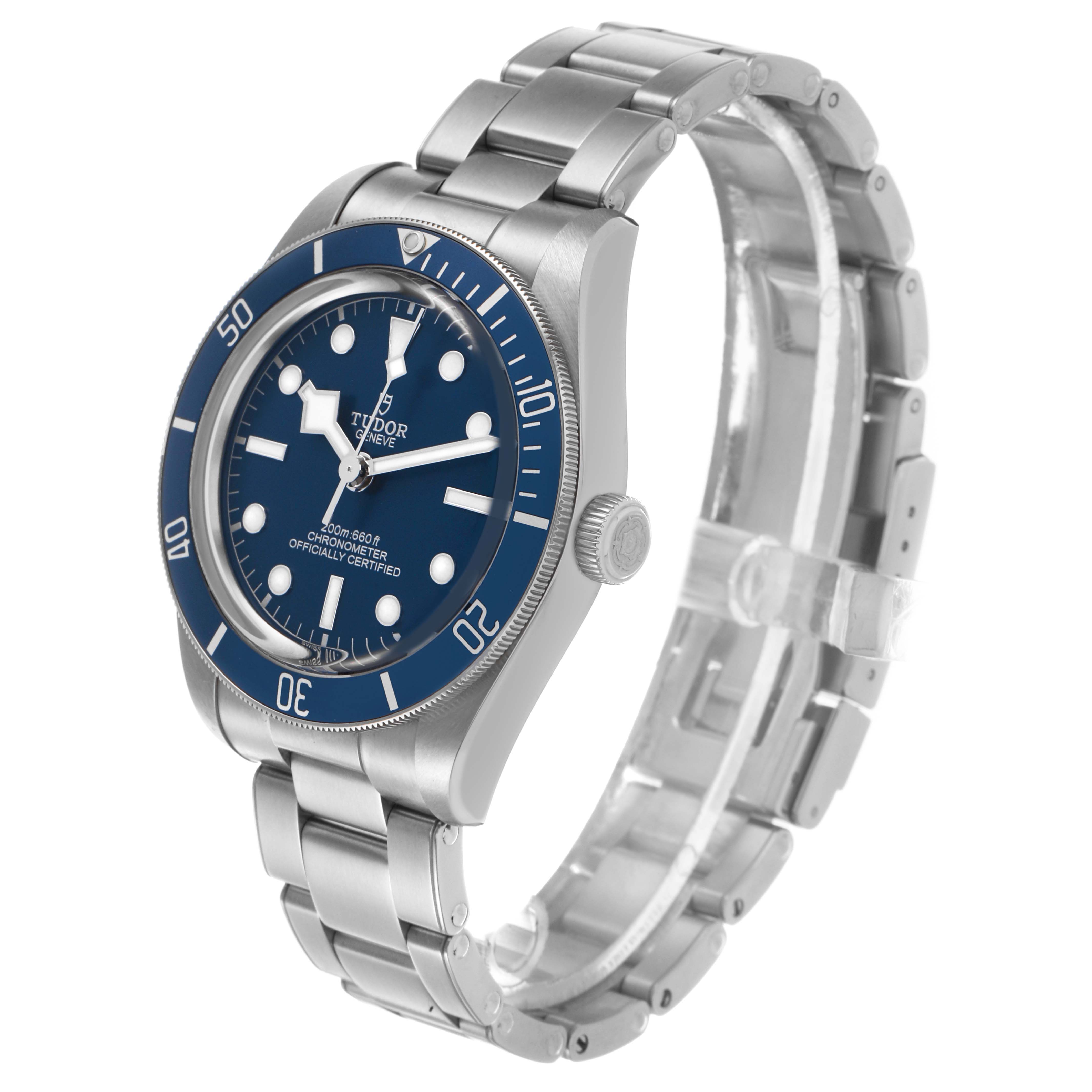 The Tudor Heritage Black Bay 79030B Men's Stainless Steel Blue Dial watch is shown at a three-quarter angle, highlighting the blue bezel, dial, crown, and metal bracelet.