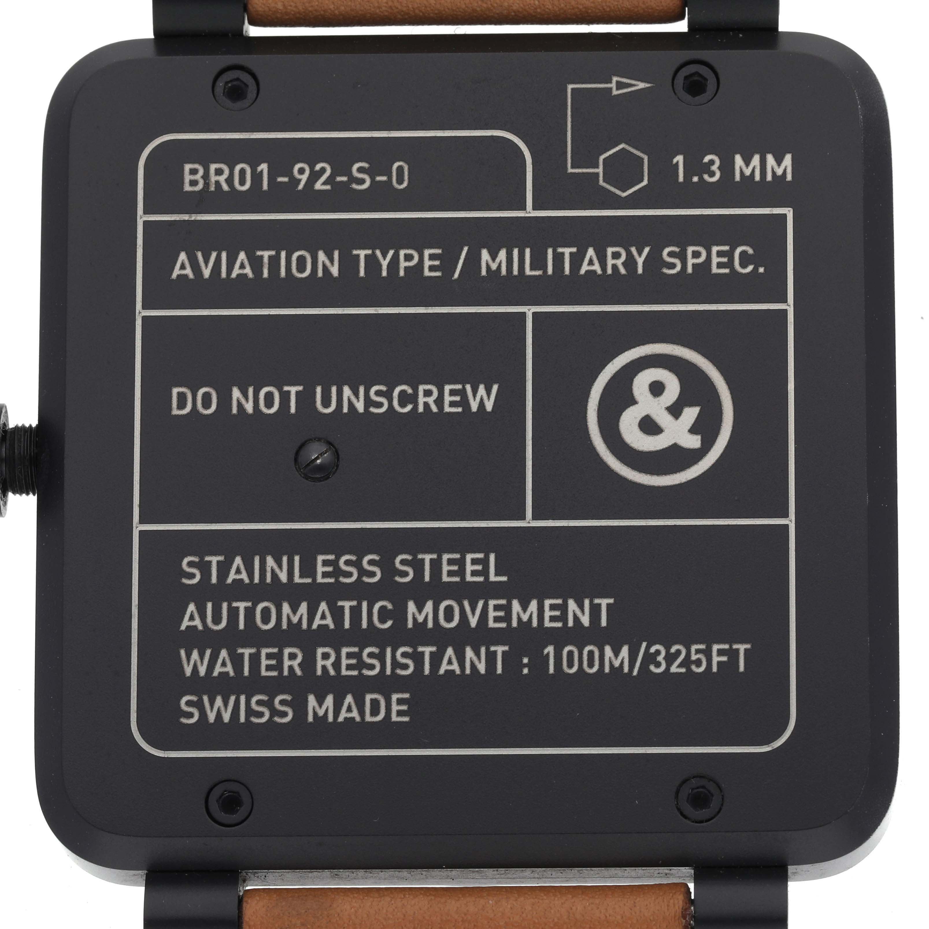The image shows the back of the Bell & Ross Heritage BR01-92-S Men's Stainless Steel Black Dial BR01-92-S Men's Stainless Steel Black Dial model watch, detailing specifications and warnings.