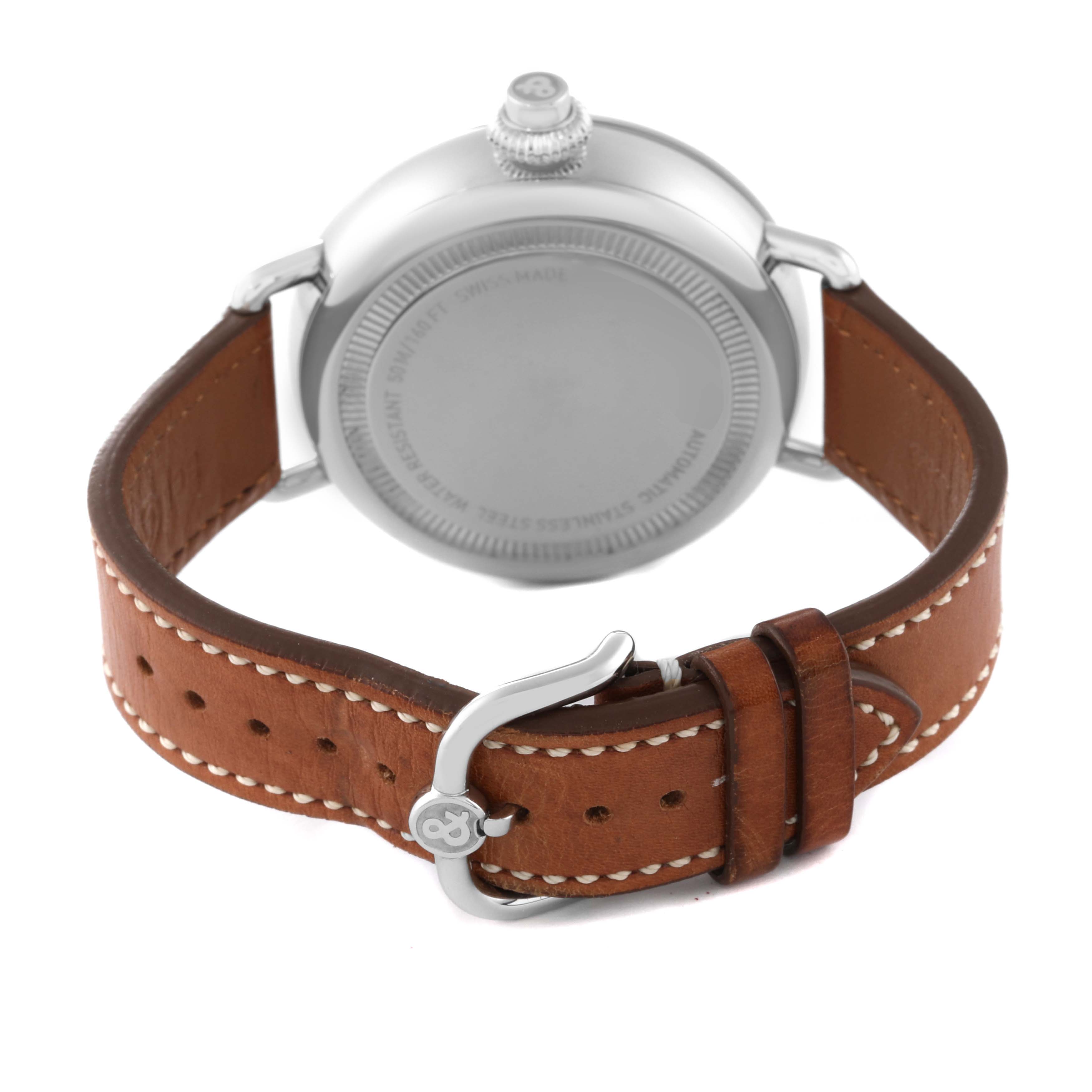 This image shows the back of a Bell & Ross Heritage BRWW1-MP01 Men's Stainless Steel Black Dial BRWW1-MP01 Men's Stainless Steel Black Dial model watch, highlighting the case back, crown, and brown leather strap with stitching.