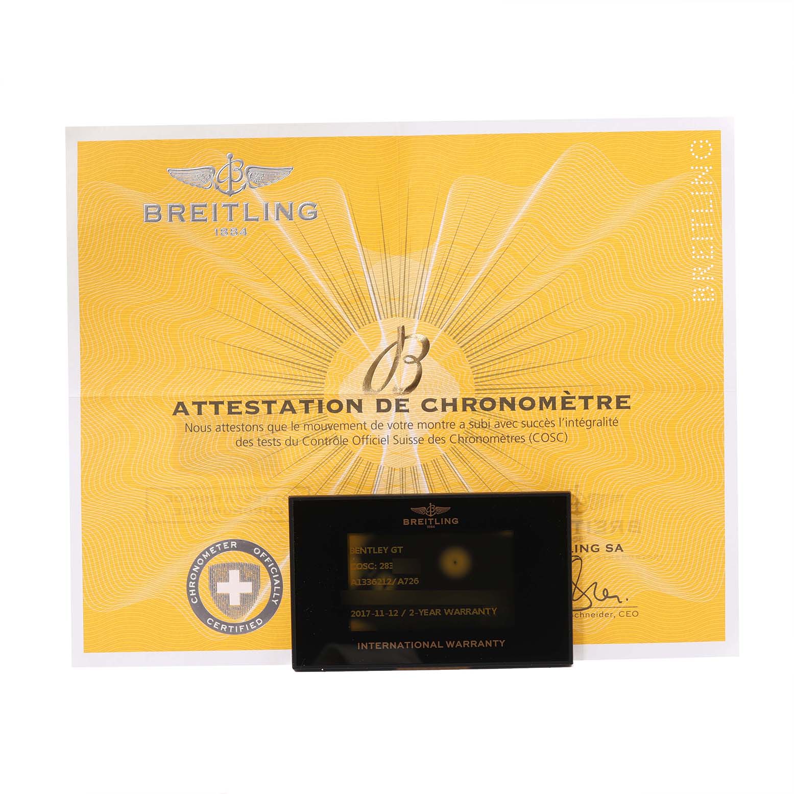 The image shows a Breitling Bentley A1336212/A726 Men
s Stainless Steel White Dial A1336212/A726 Men
s Stainless Steel White Dial model
s certificate of chronometer performance and an international warranty card.