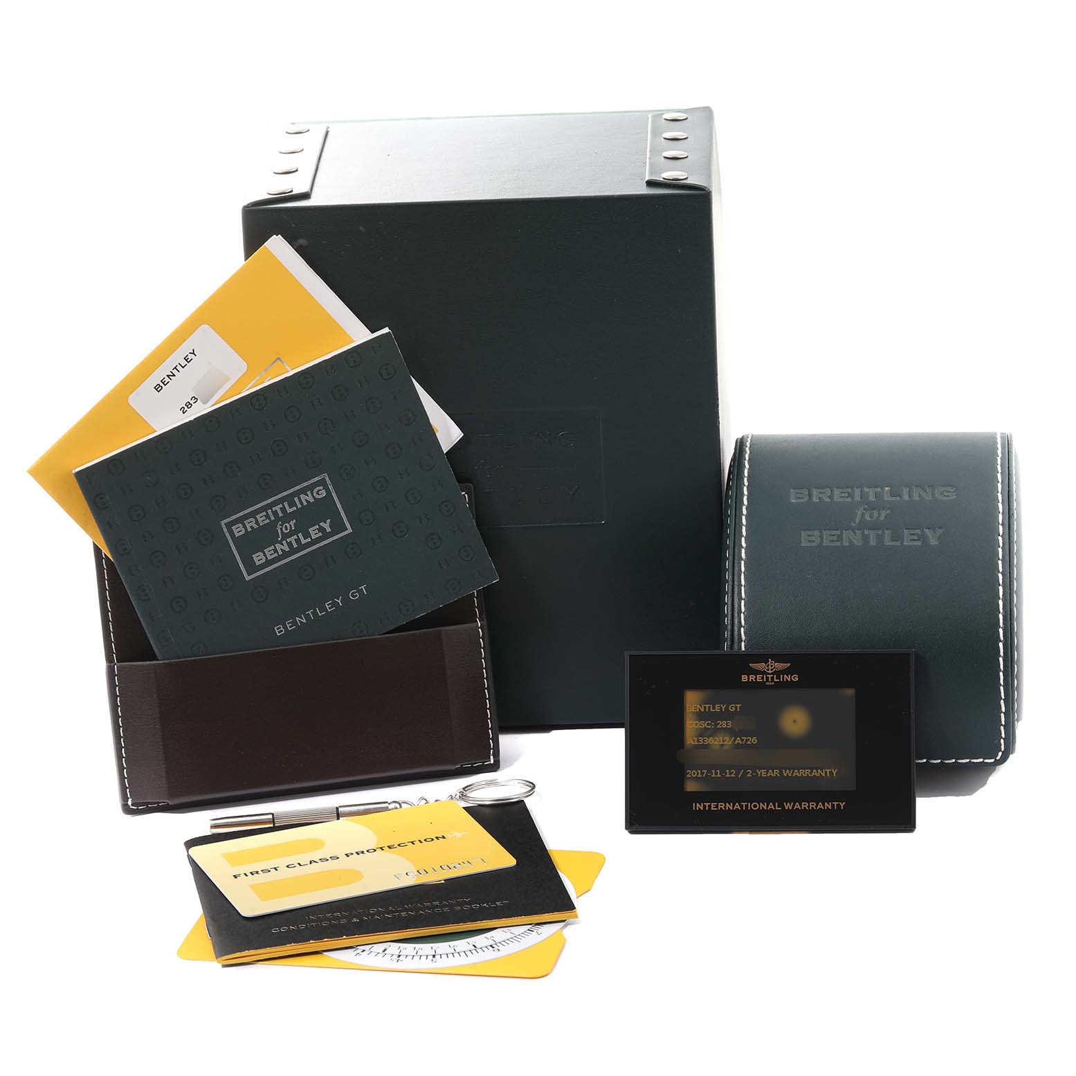 Breitling Bentley A1336212/A726 Men
s Stainless Steel White Dial A1336212/A726 Men
s Stainless Steel White Dial watch accessories including manuals, warranty cards, and a carrying case are shown from a front angle.