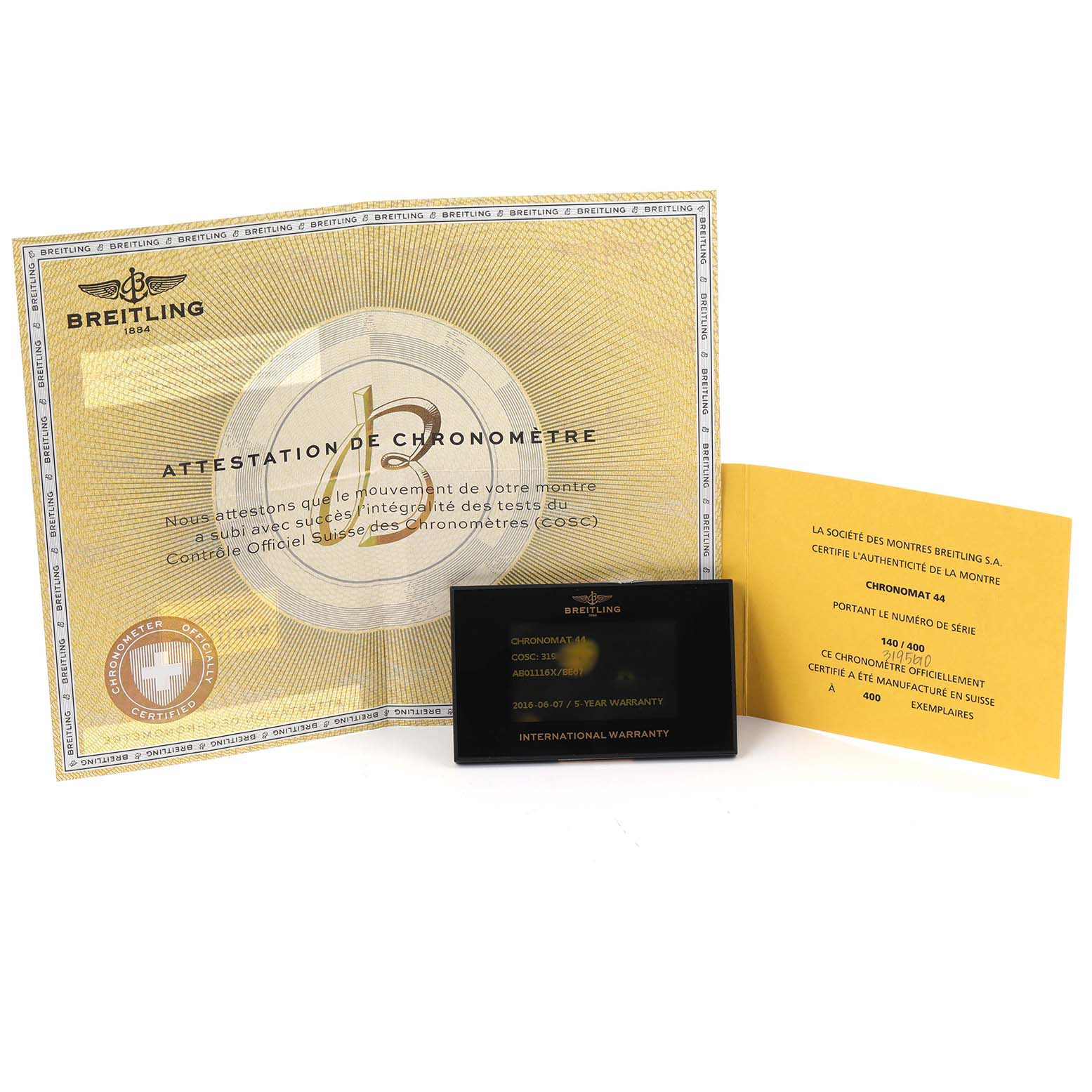 The image shows Breitling Chronomat AB0111 documentation, including a chronometer certificate, warranty card, and authenticity booklet.