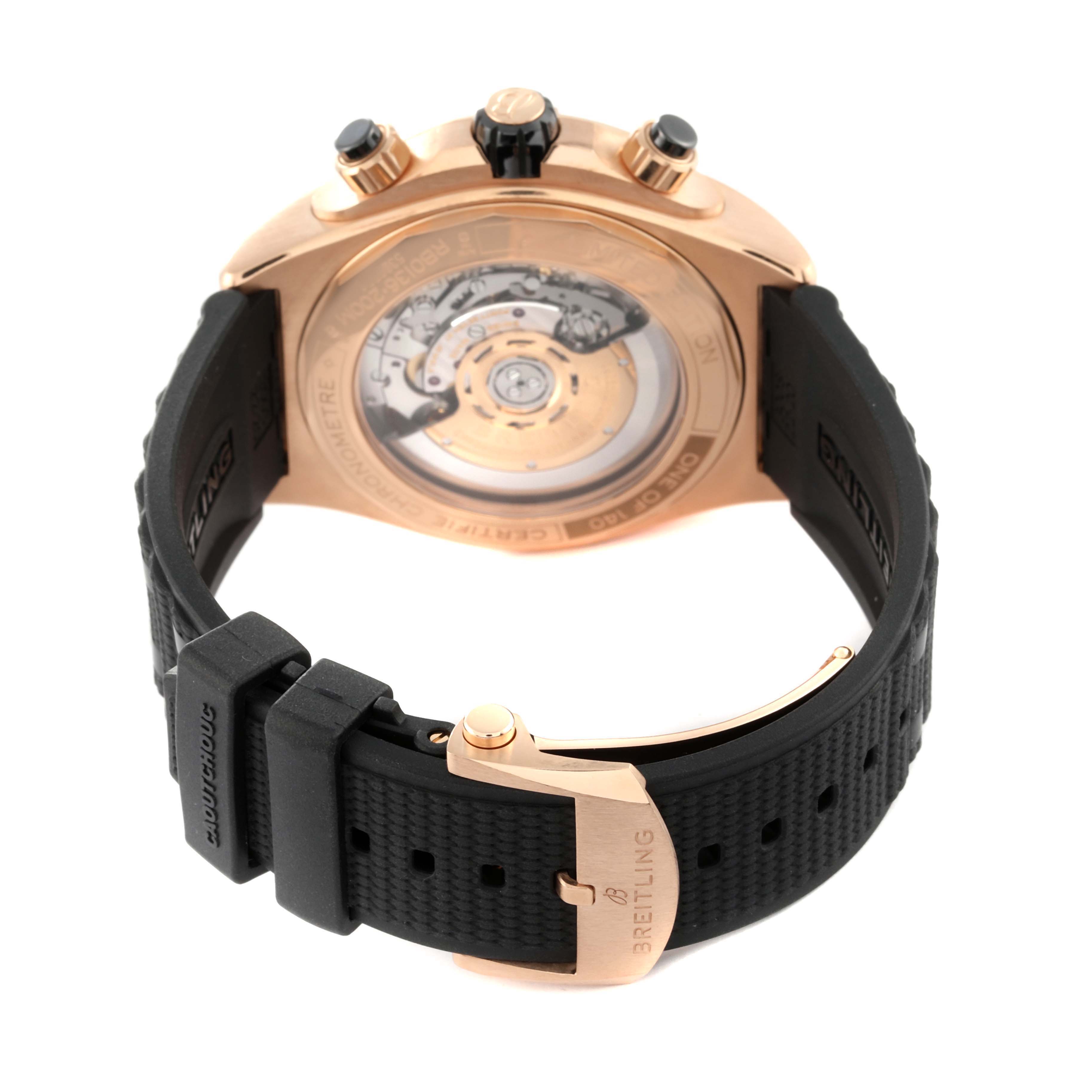 The image shows the back view of a Breitling Chronomat RB0136 Men's Rose Gold Blue Dial RB0136 Men's Rose Gold Blue Dial watch, highlighting the transparent case back and black rubber strap.