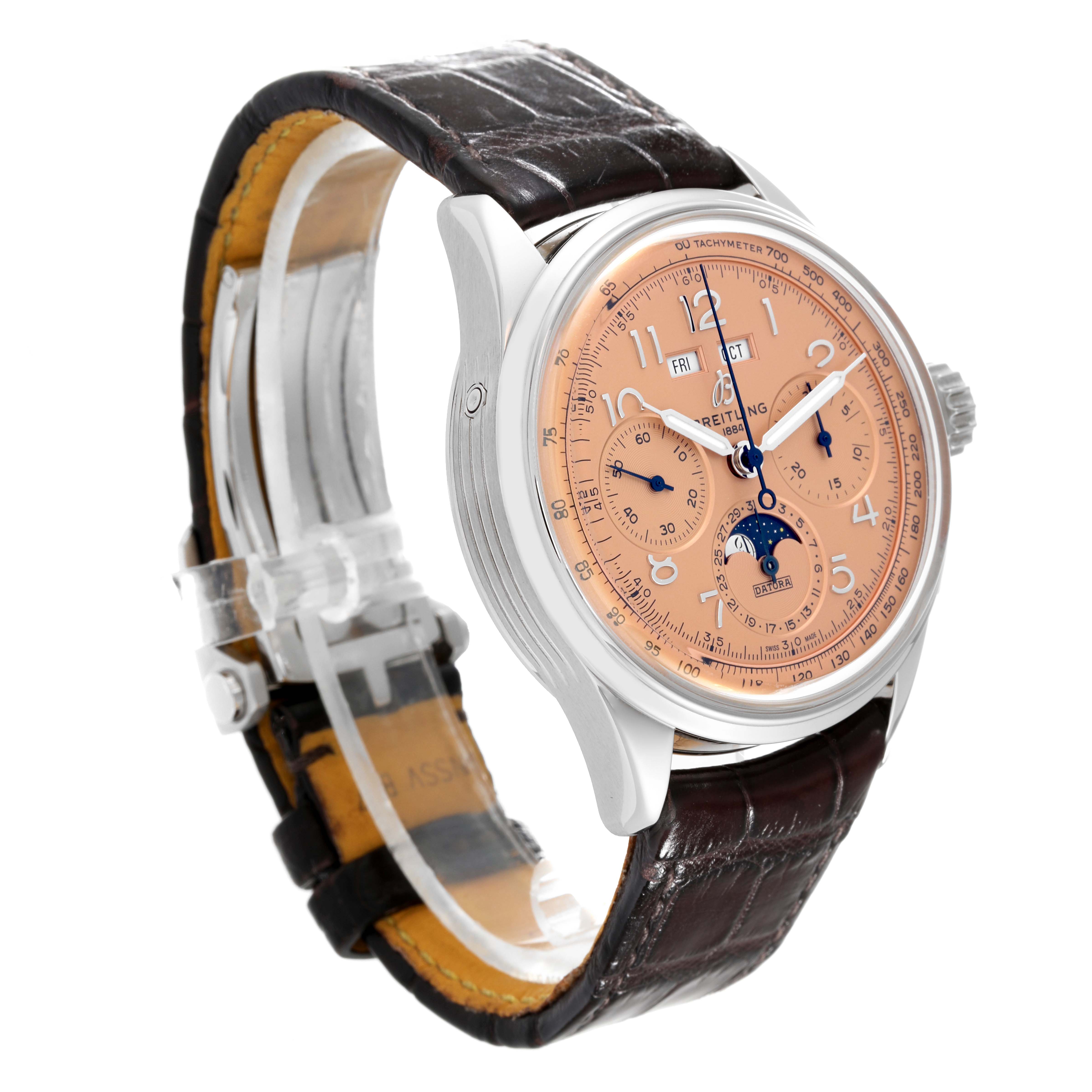 The Breitling Premier AB2510201K1P1 Men's Stainless Steel Pink Dial AB2510201K1P1 Men's Stainless Steel Pink Dial watch is shown at an angle, highlighting its face, case, crown, and leather strap.