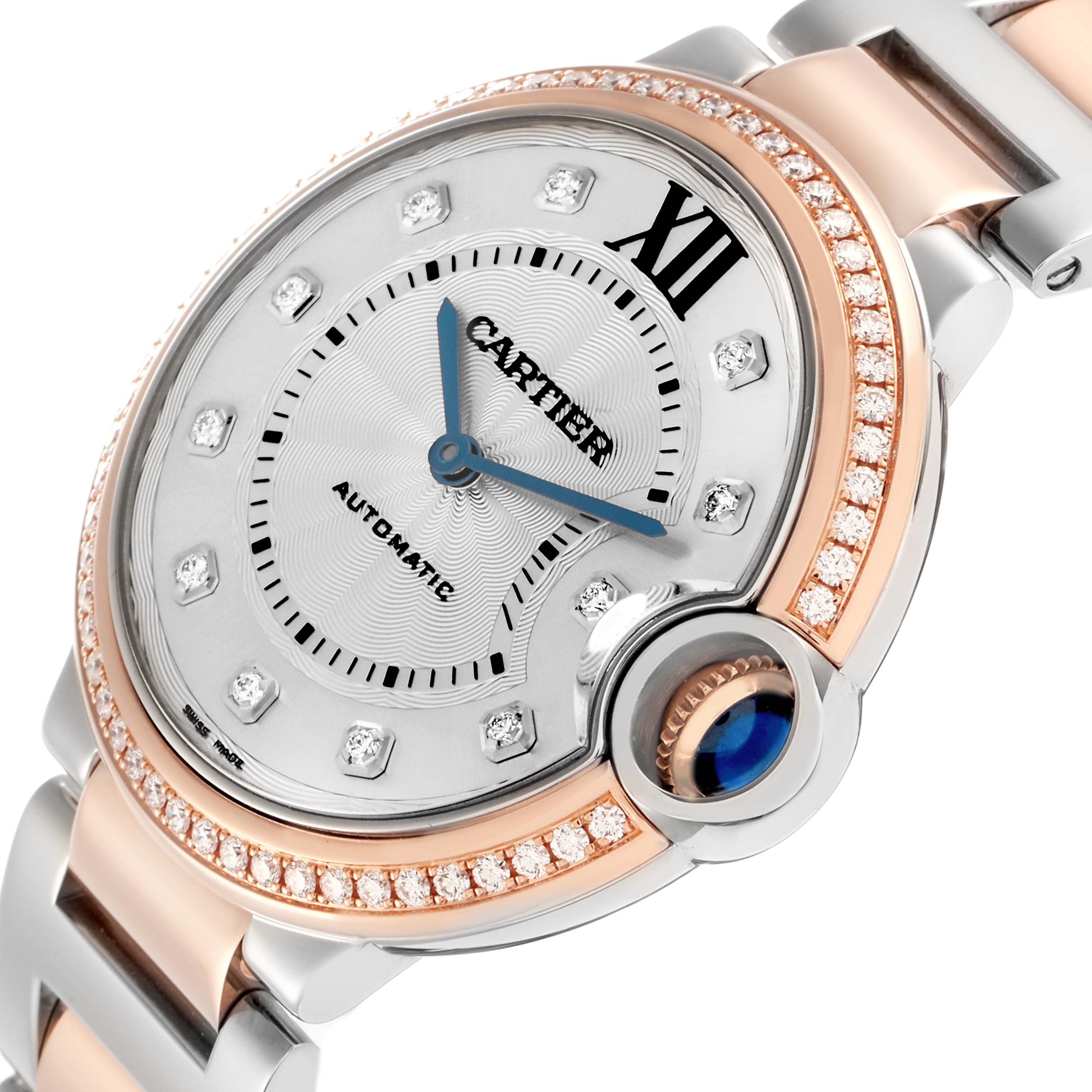 The Cartier Ballon Bleu model W3BB0004 is shown at a tilted angle, highlighting its diamond-set bezel, silver dial, blue hands, and distinctive crown.