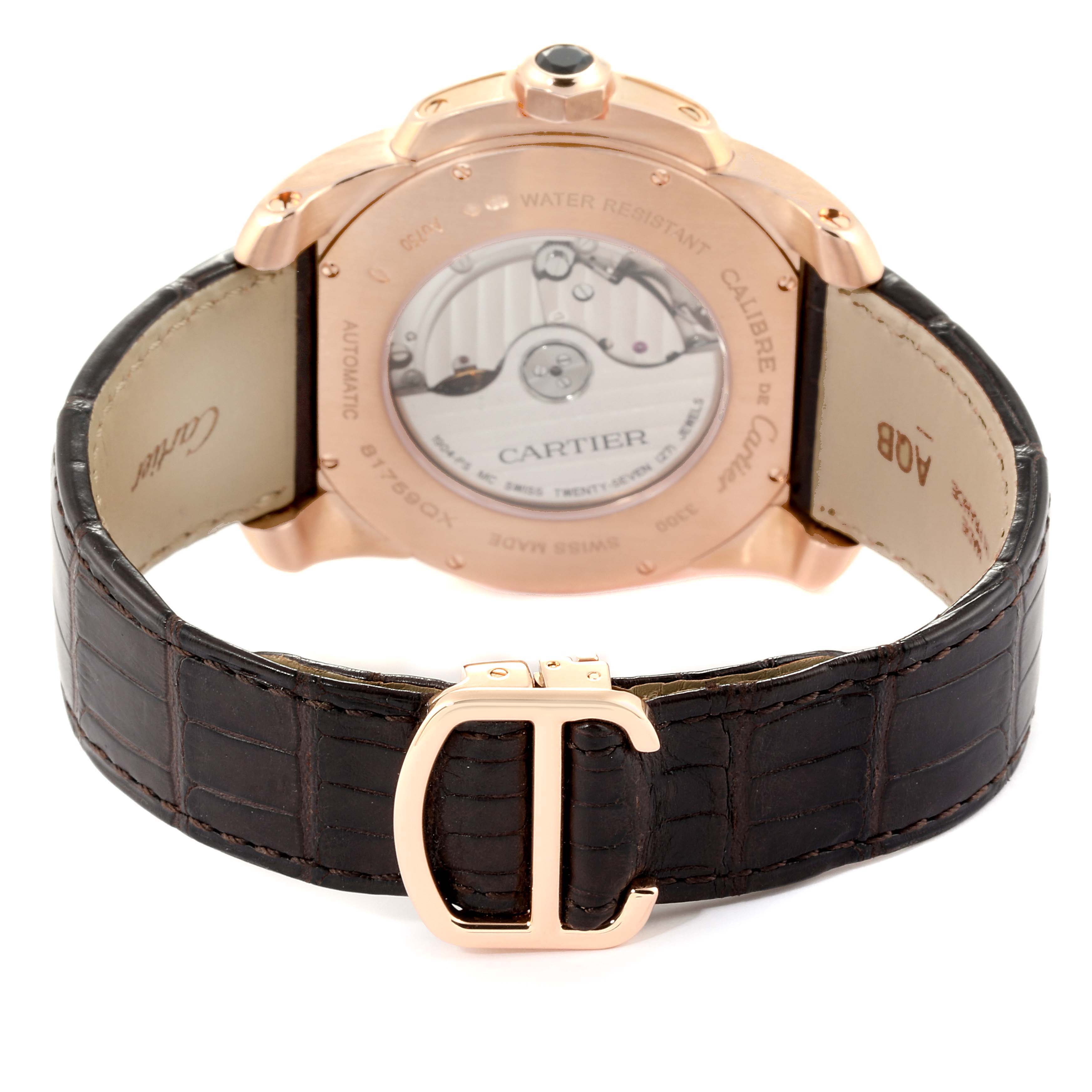 The image shows the back view of a Calibre de Cartier watch by Cartier, highlighting the case back, movement, and leather strap.