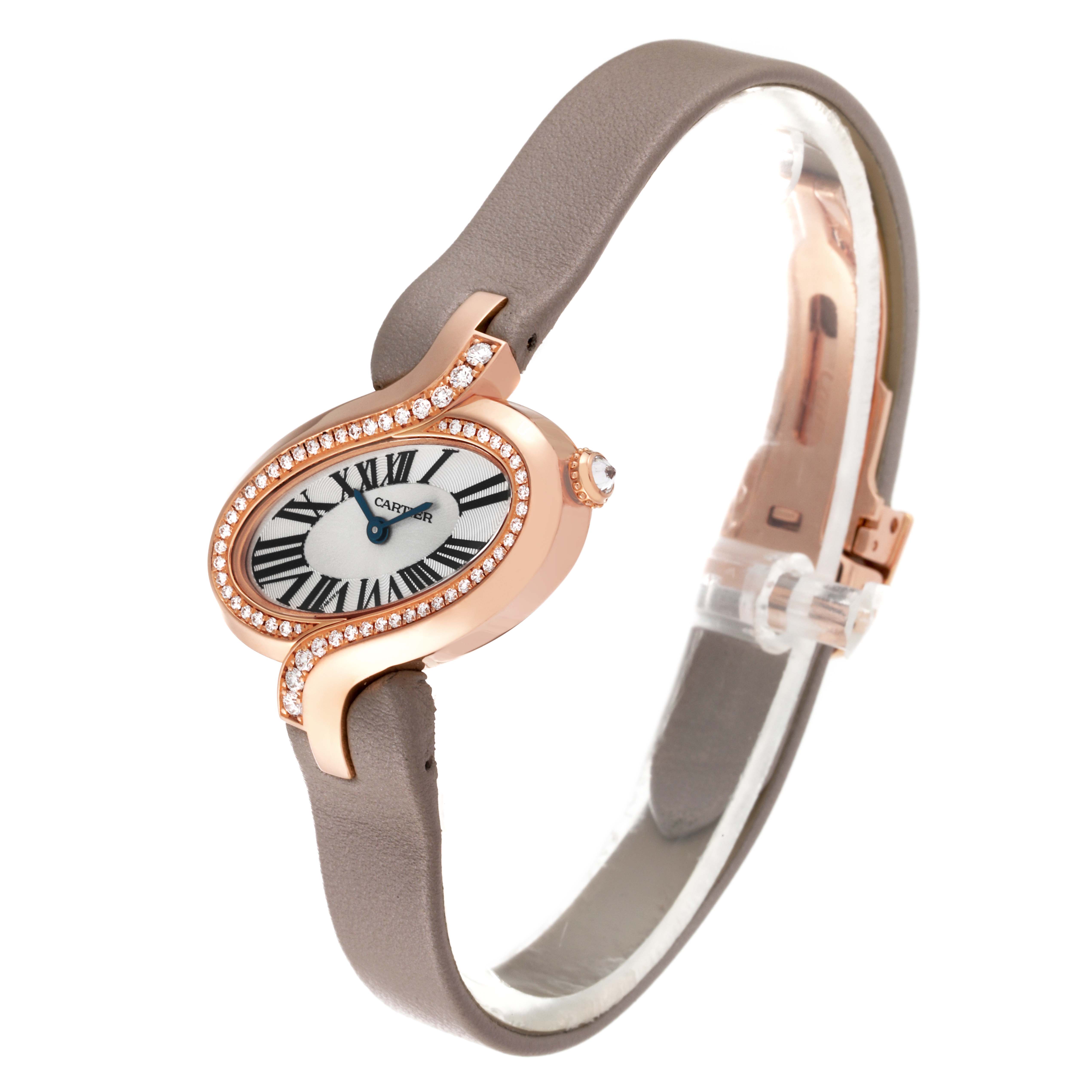 The image shows a Cartier Delices WG800013 Women
s Rose Gold Silver Dial WG800013 Women
s Rose Gold Silver Dial watch from a three-quarter angle, highlighting its face, case, and strap.