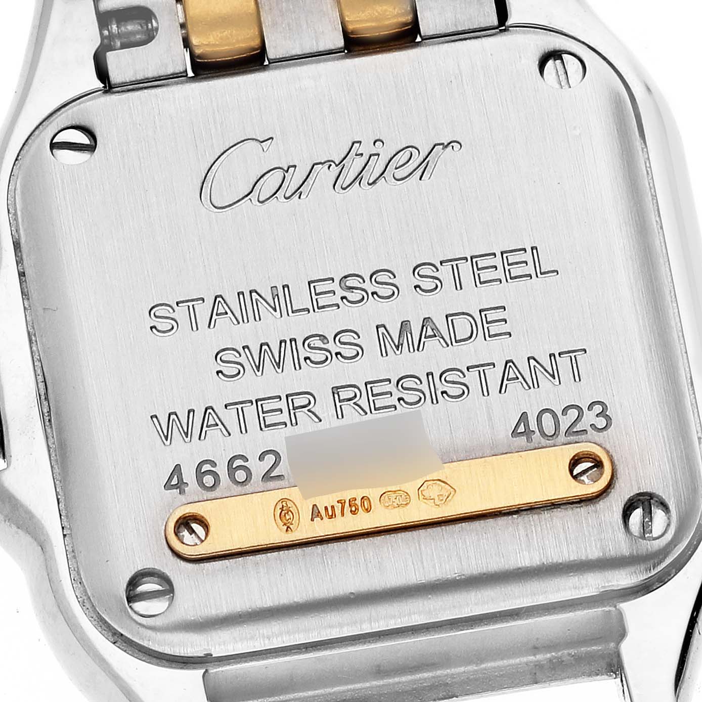 This image shows the back case of a Cartier Panthere W2PN0006 Women's Steel and Gold (two tone) Silver Dial W2PN0006 Women's Steel and Gold (two tone) Silver Dial watch, highlighting its inscriptions and materials.