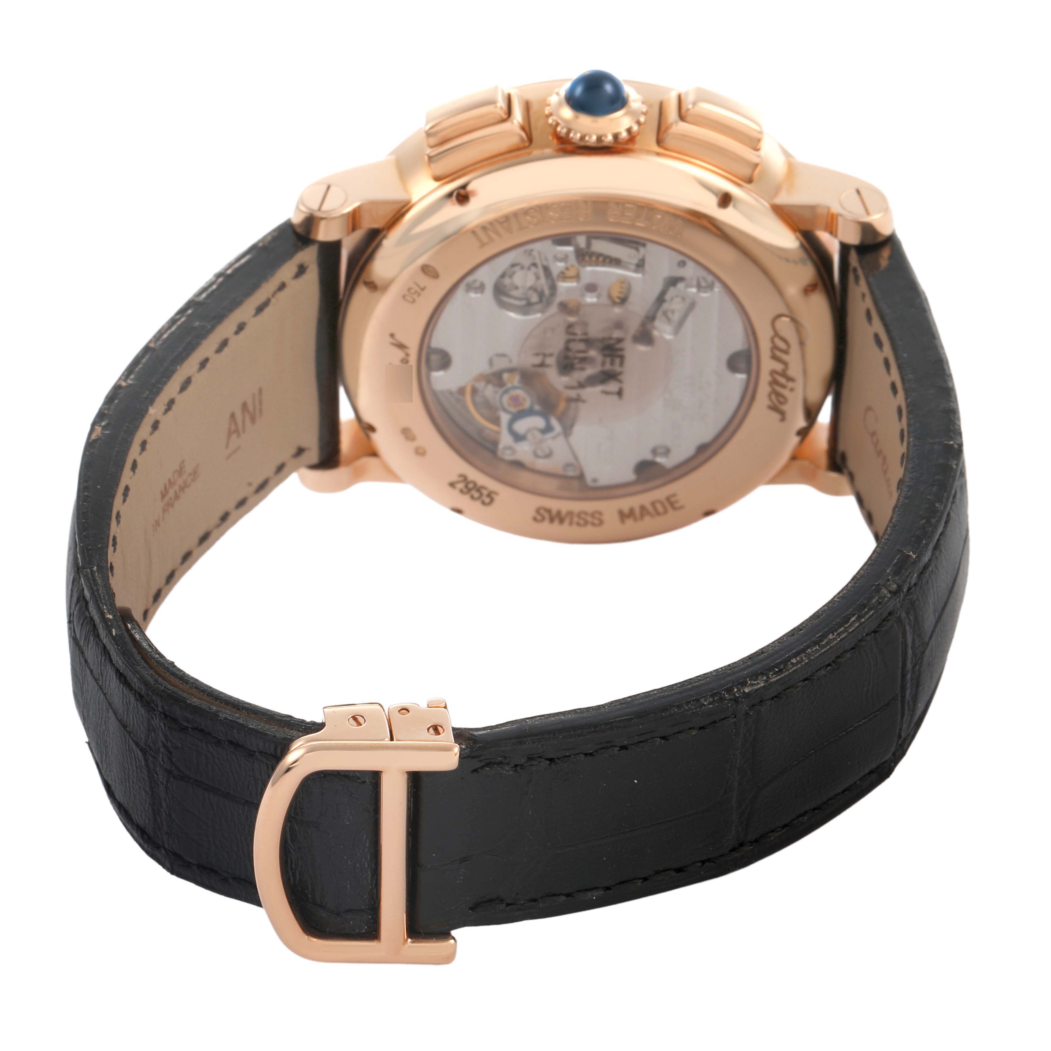 The Cartier Rotonde W1555951 Men's Rose Gold Silver Dial watch is shown from the back, highlighting its movement through the transparent case back and featuring a black leather strap.