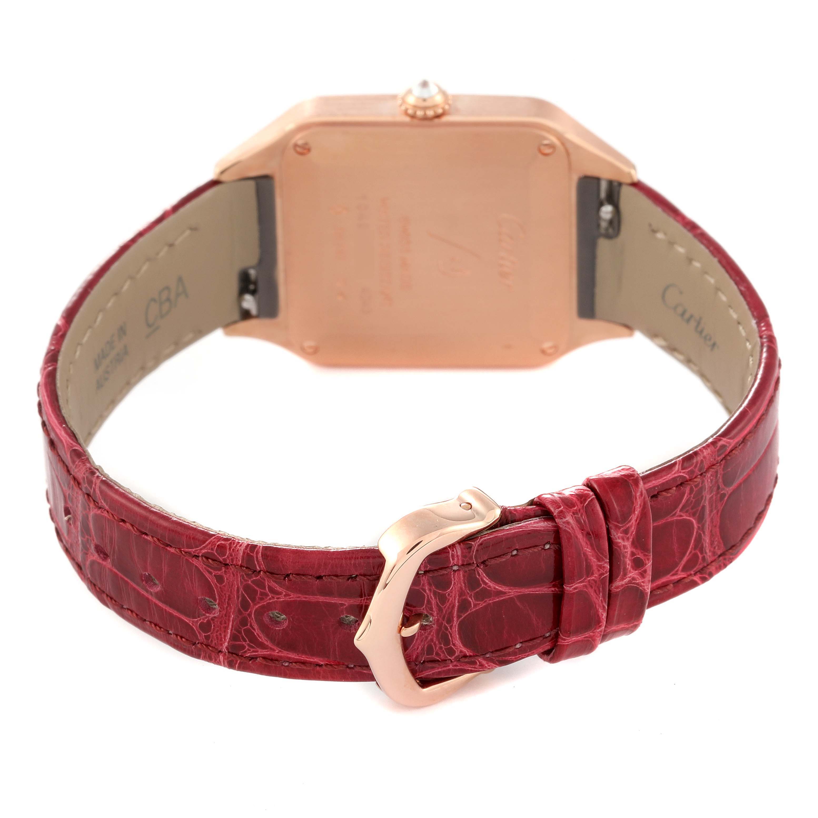 The image shows the back of a Cartier Santos WJSA0017 Women's Rose Gold Silver Dial WJSA0017 Women's Rose Gold Silver Dial watch and a detailed view of its red leather strap and buckle.