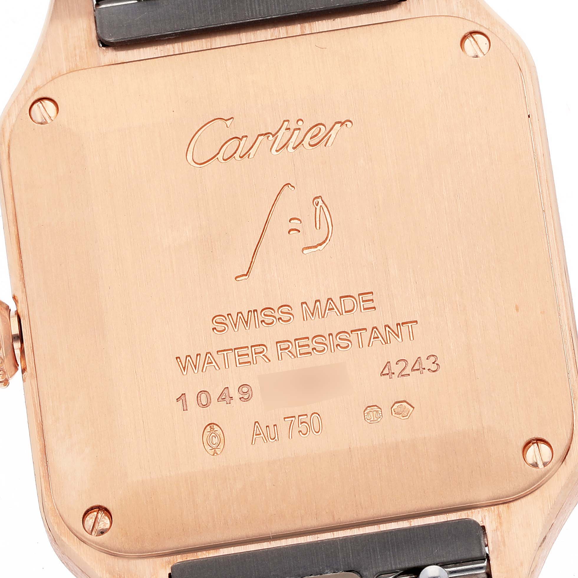 The image shows the back case of a Cartier Santos WJSA0017 Women's Rose Gold Silver Dial WJSA0017 Women's Rose Gold Silver Dial watch, highlighting the inscriptions and water resistance details.