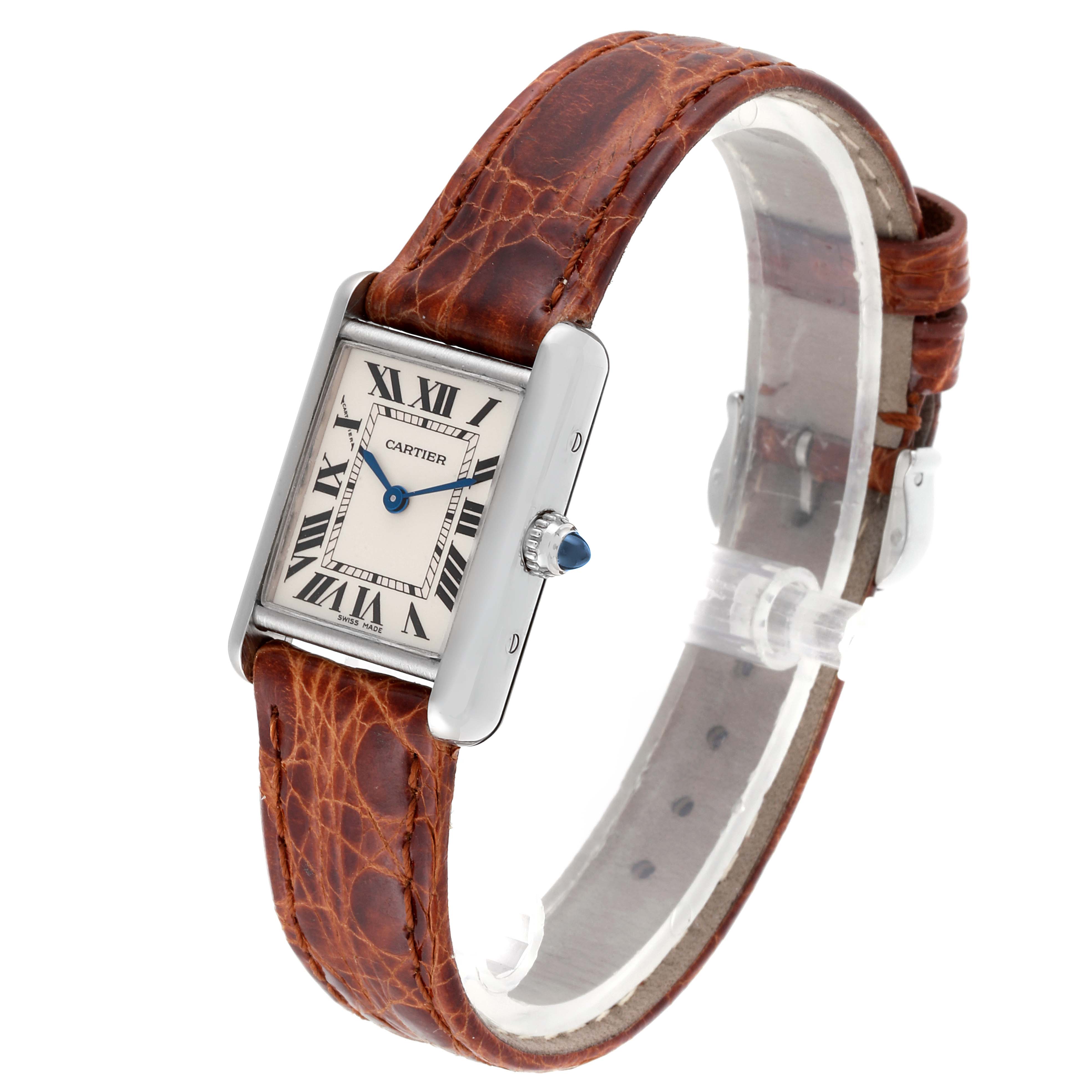 The image displays a Tank Louis model by Cartier at a slight angle, showcasing its face, strap, and crown.