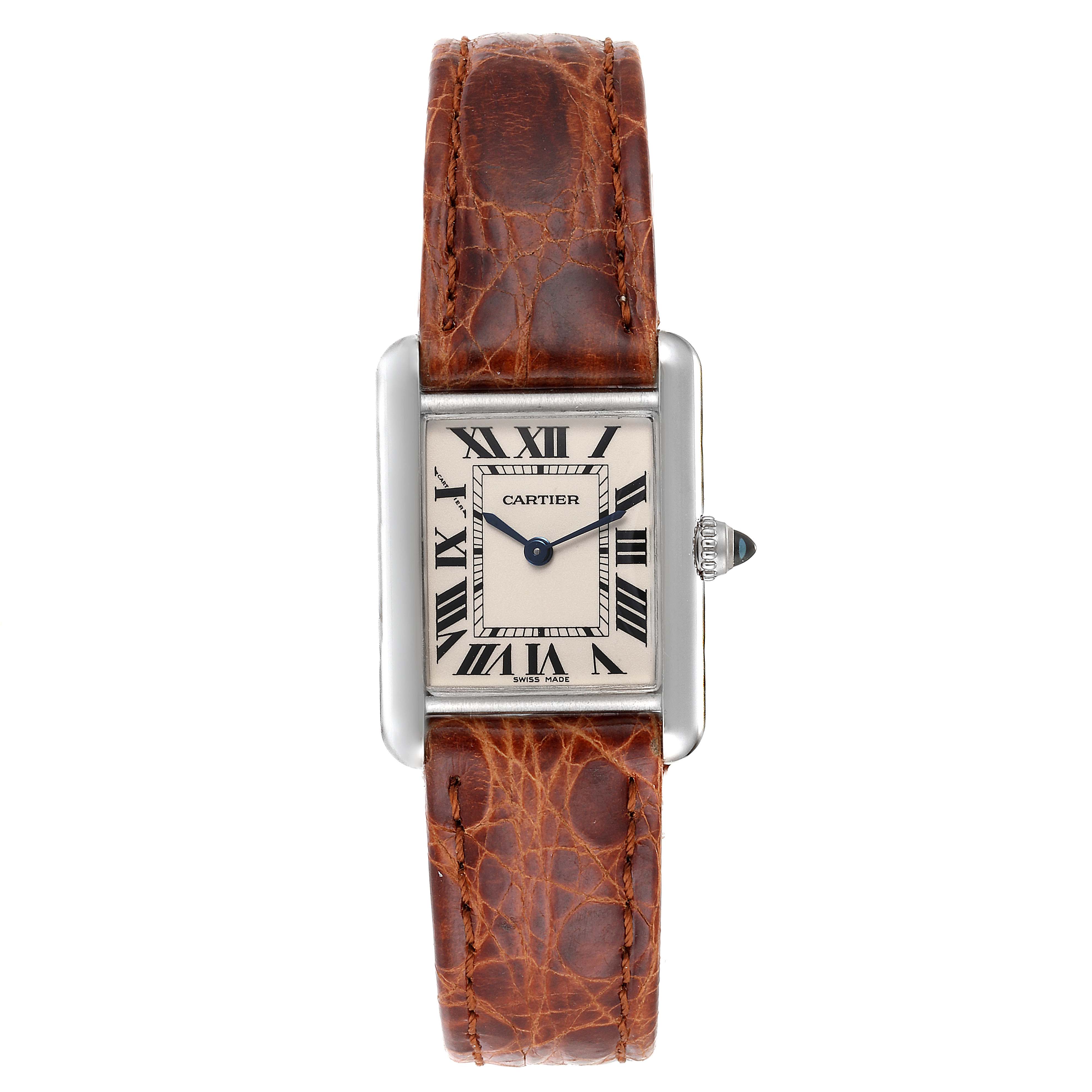 The Cartier Tank Louis W1541056 Women
s White Gold Silver Dial W1541056 Women
s White Gold Silver Dial watch is shown from a front angle, highlighting its rectangular face, Roman numerals, and brown leather strap.