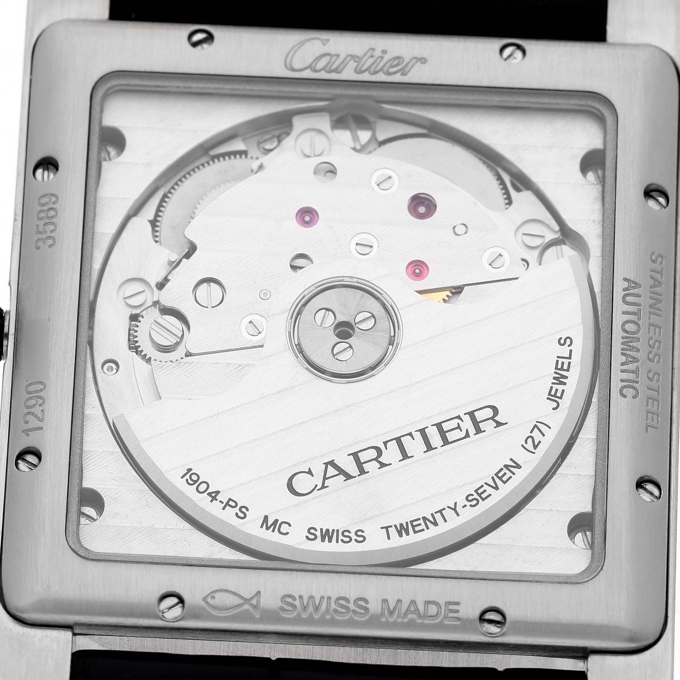 The Tank MC by Cartier is shown from the back, displaying its automatic movement and engraving details.
