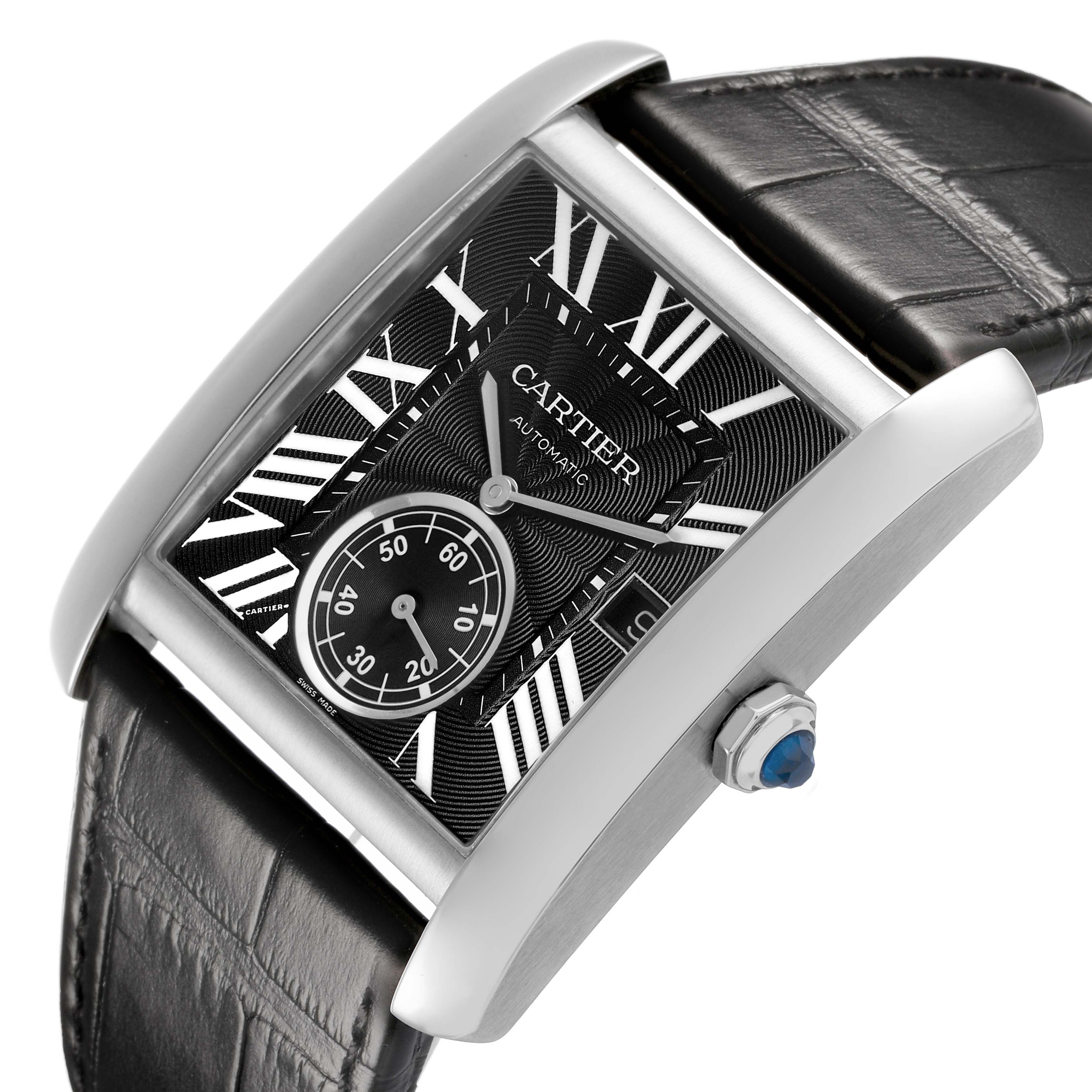 The Cartier Tank MC W5330004 Men's Stainless Steel Black Dial watch is shown at an angled side view, highlighting the black leather strap, square dial, and crown with a blue cabochon.