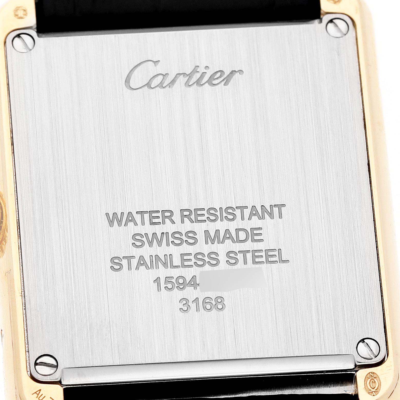 The image shows the back case of a Cartier Tank Solo W5200024 Women's Yellow Gold Silver Dial watch, displaying branding and specifications.