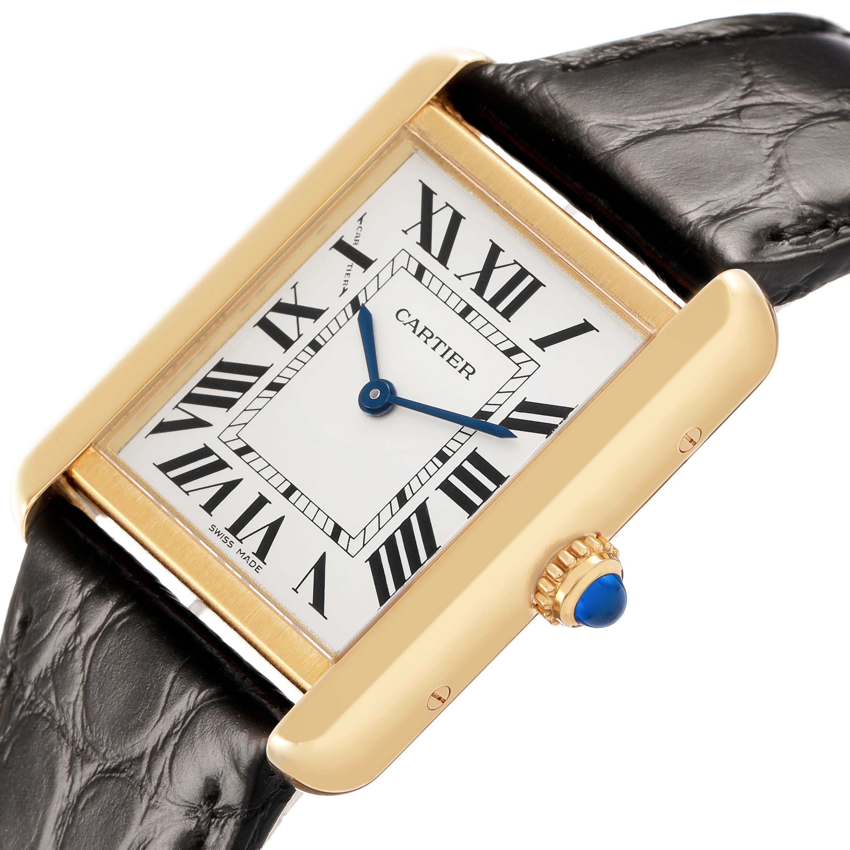 The Cartier Tank Solo W5200024 Women's Yellow Gold Silver Dial watch is shown at a slight angle, highlighting its rectangular face, Roman numeral dial, and blue cabochon crown.