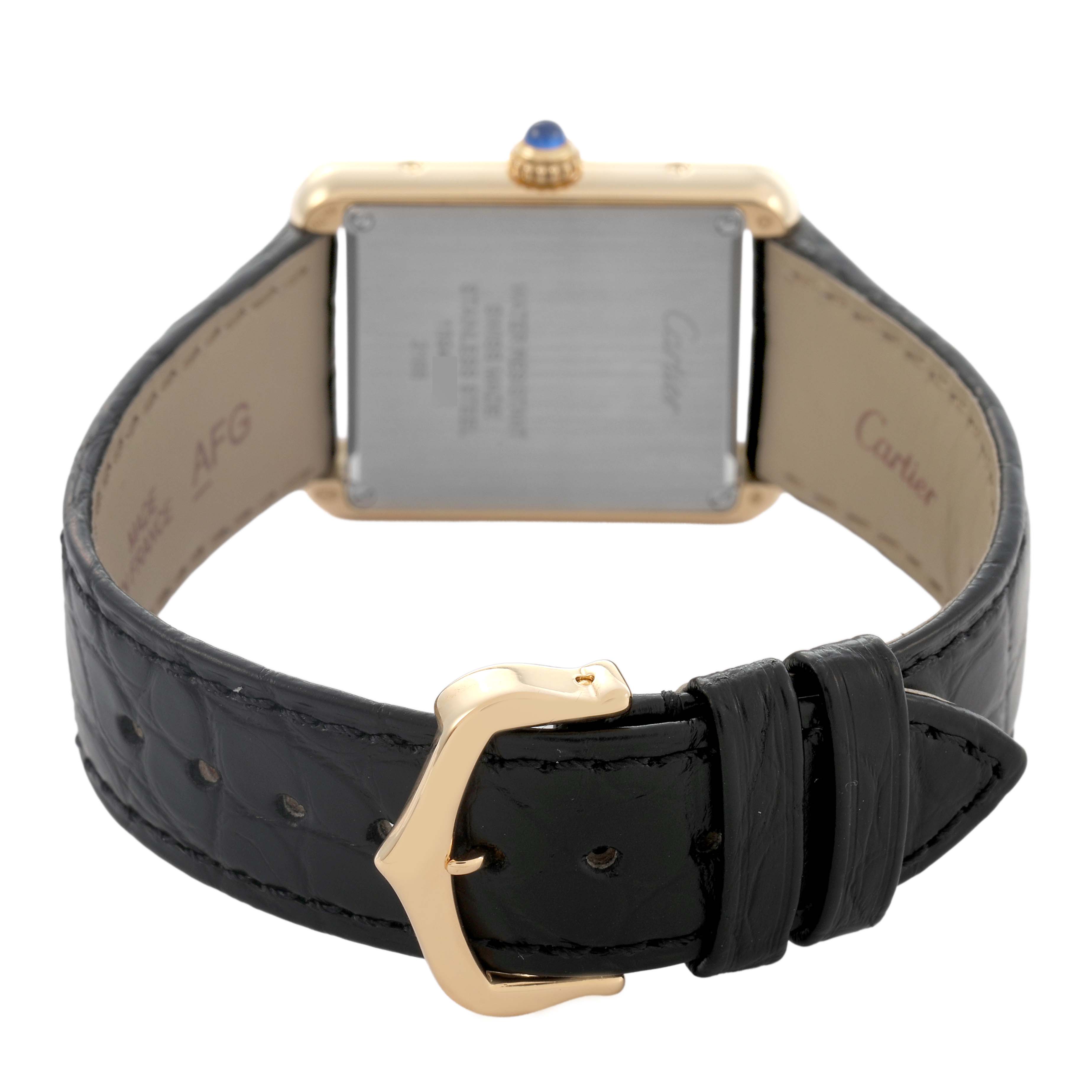 The image shows the back view of a Cartier Tank Solo W5200024 Women's Yellow Gold Silver Dial watch, highlighting the case back, crown, and black leather strap with a gold buckle.