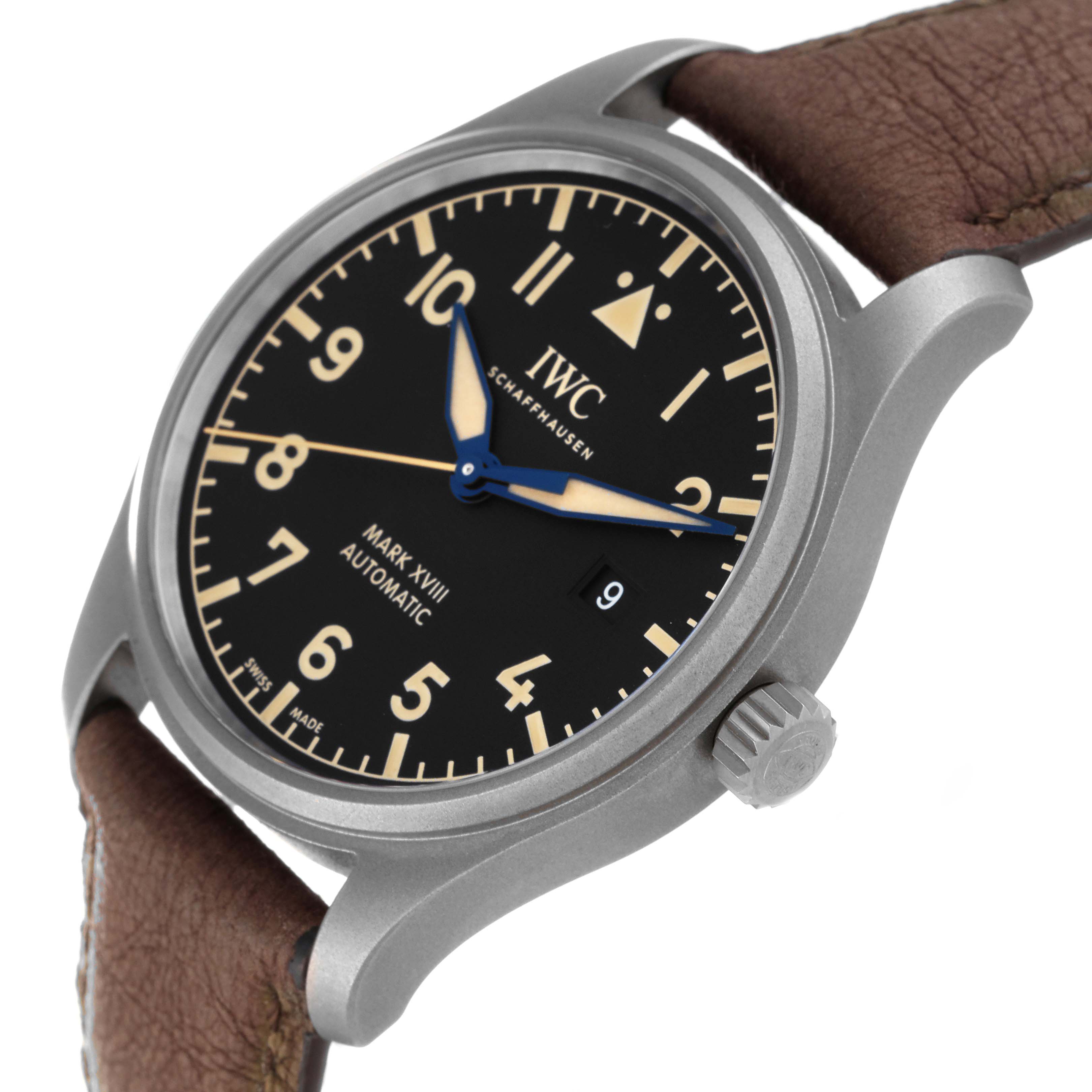 The image shows an angled view of the IWC Pilot IW327006 Men's Titanium Black Dial IW327006 Men's Titanium Black Dial Mark XVIII watch, highlighting the face, crown, and leather strap.