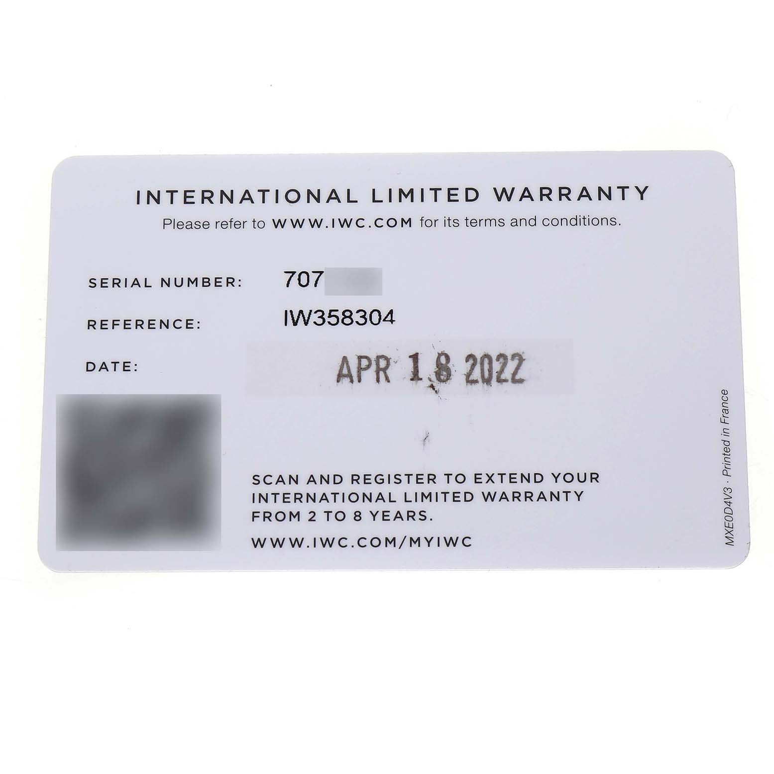 The image shows an IWC International Limited Warranty card for the Portuguese model, displaying serial and reference numbers.