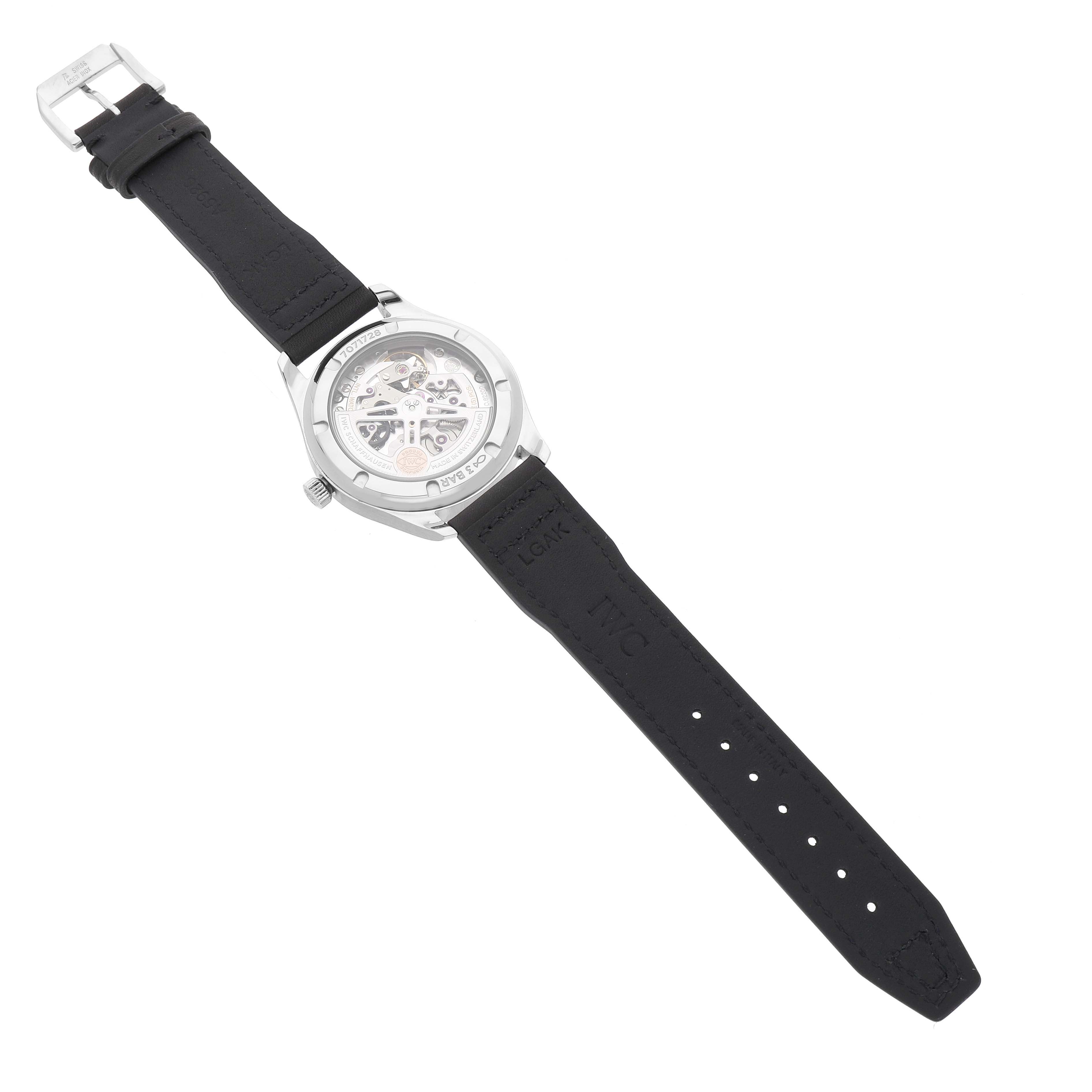 The IWC Portuguese IW358304 Men's Stainless Steel Silver Dial watch is shown from the back, displaying the movement through a transparent case back, with a visible strap and buckle.