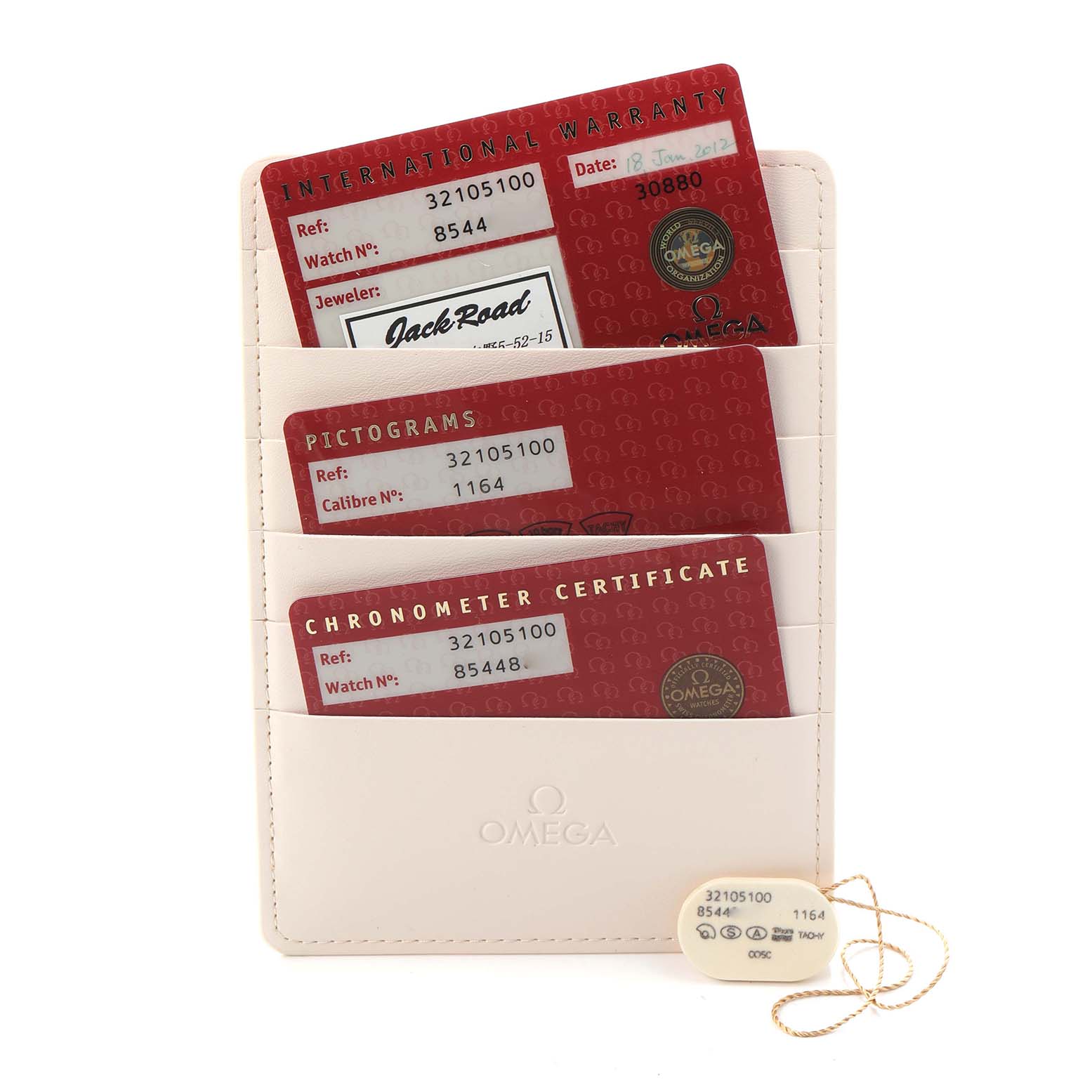 The image shows the warranty cards and certificates for the Omega Speedmaster model 3210.51.00, including the reference and watch number details.