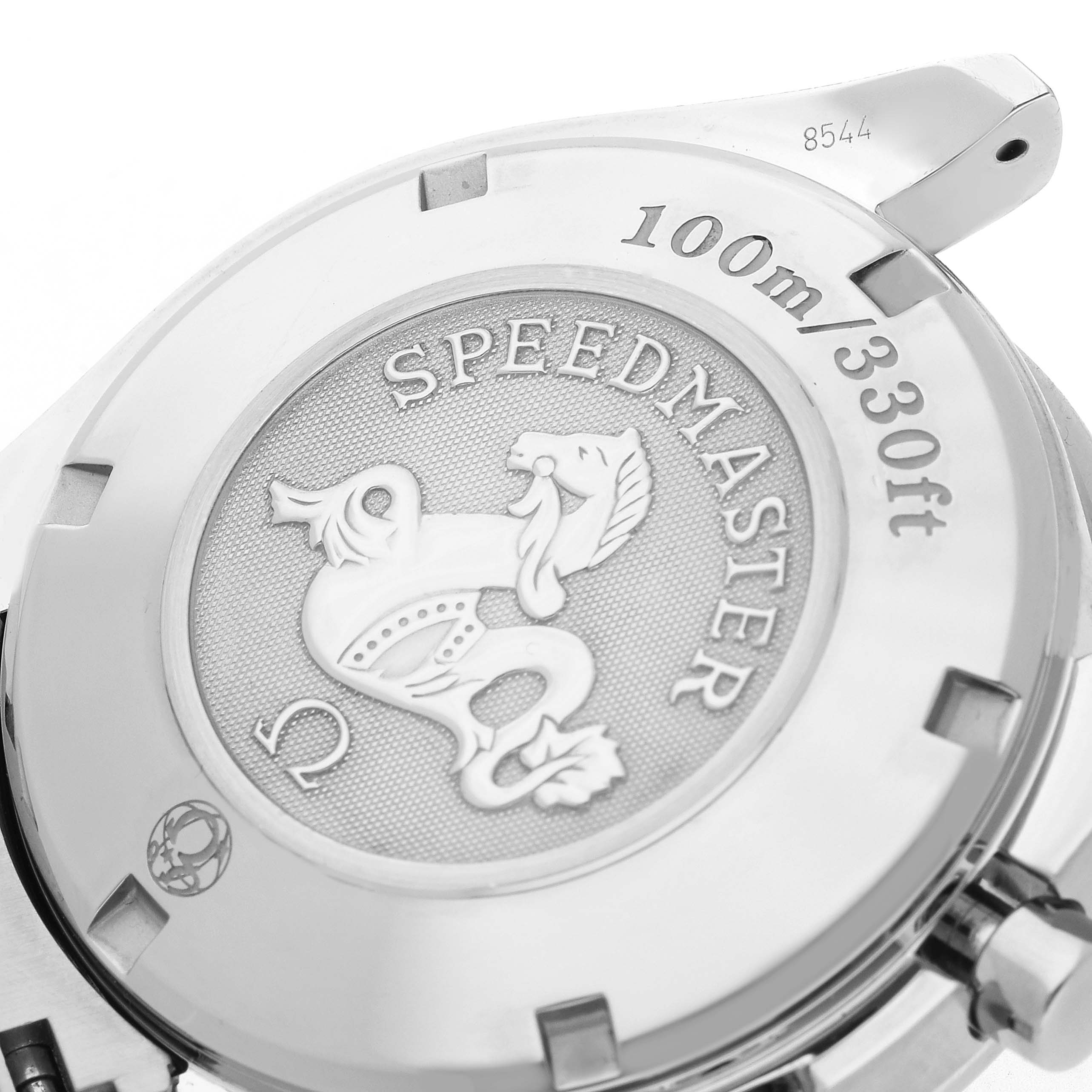 The image shows the back of an Omega Speedmaster model 3210.51.00, featuring the engraved seahorse design and water resistance marking.