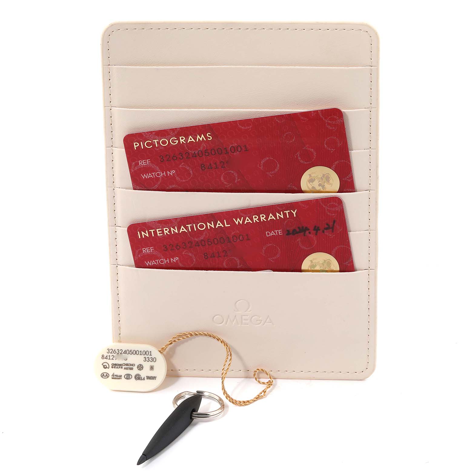 The image shows Omega Speedmaster 326.32.40.50.01.001 Men
s Stainless Steel Black Dial 326.32.40.50.01.001 Men
s Stainless Steel Black Dial documentation, including warranty and pictogram cards, along with a tag and key.