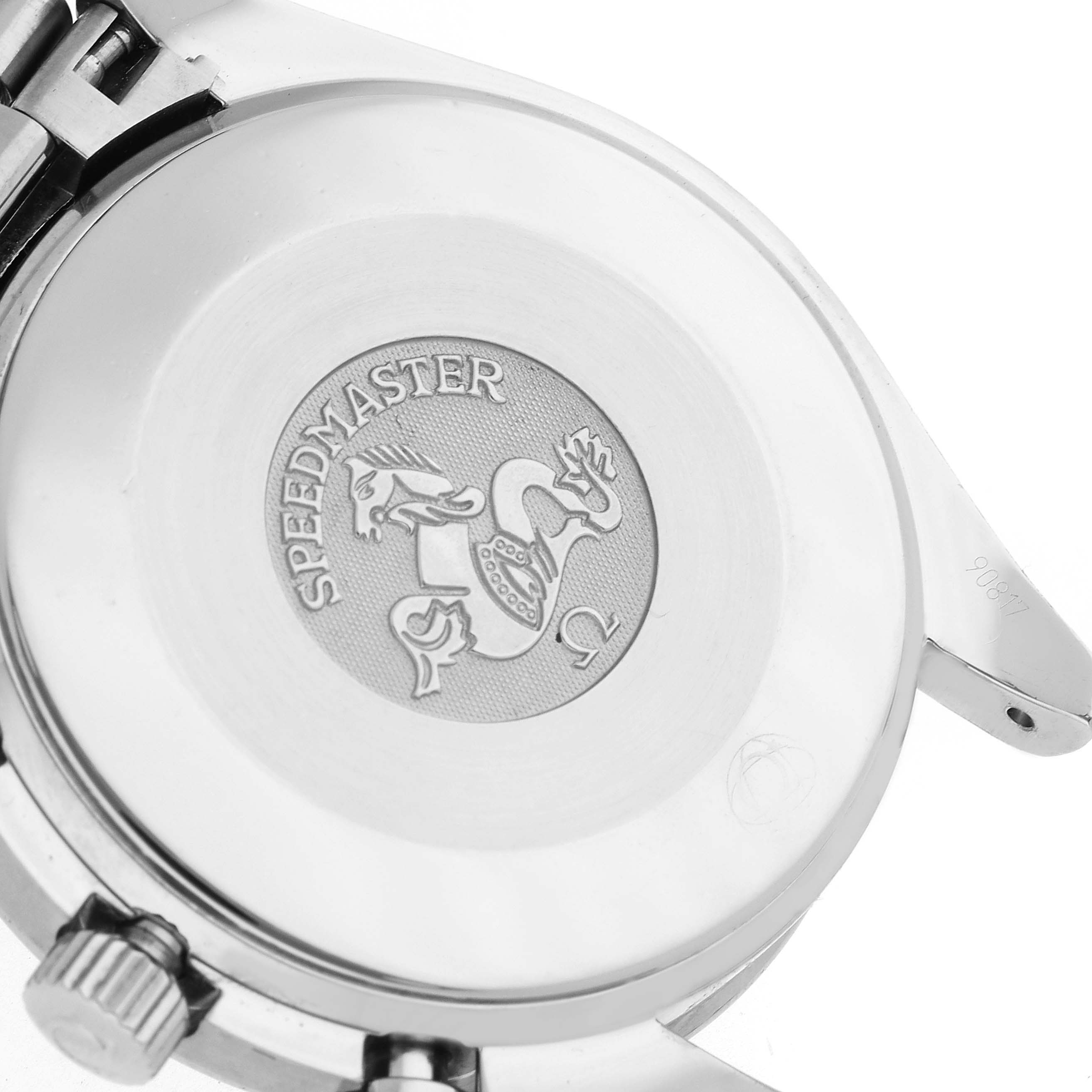 The image shows the back of the Omega Speedmaster model 3539.50.00, displaying its engraved emblem and part of the bracelet attachment.