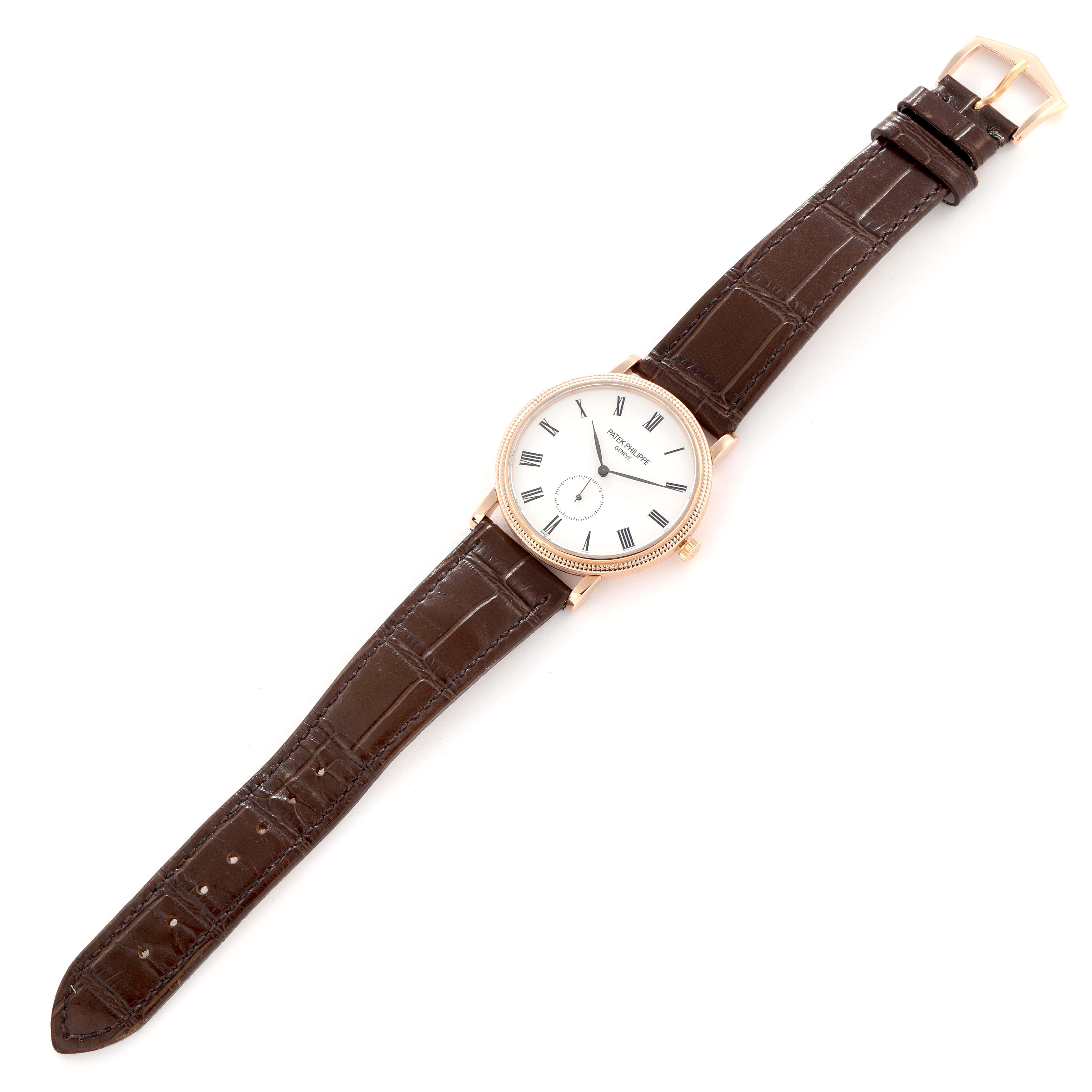 The Patek Philippe Calatrava model 5116R men
s watch is shown at a slight angle, displaying the full face, case, and brown leather strap fully extended.