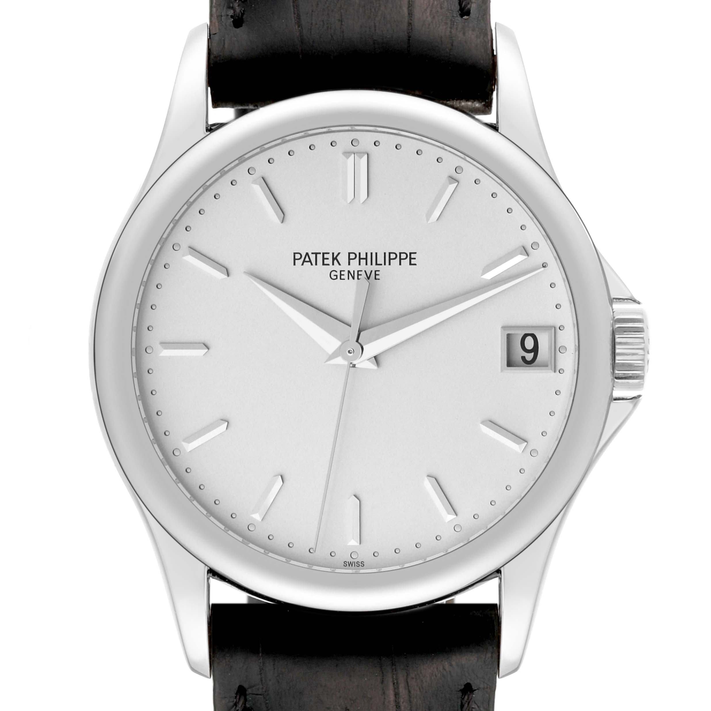 The image shows a front view of the Patek Philippe Calatrava 5127G-001 Men's White Gold Silver Dial 5127G-001 Men's White Gold Silver Dial watch displaying the dial, hands, date window, and part of the leather strap.