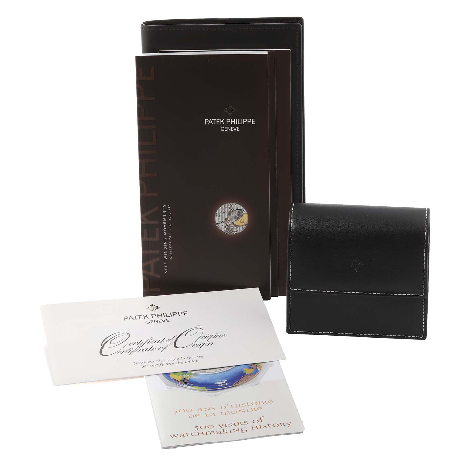 The image shows the packaging and documents for a Patek Philippe Calatrava 5127G-001 Men's White Gold Silver Dial 5127G-001 Men's White Gold Silver Dial watch, including booklets, a certificate, and a leather case.