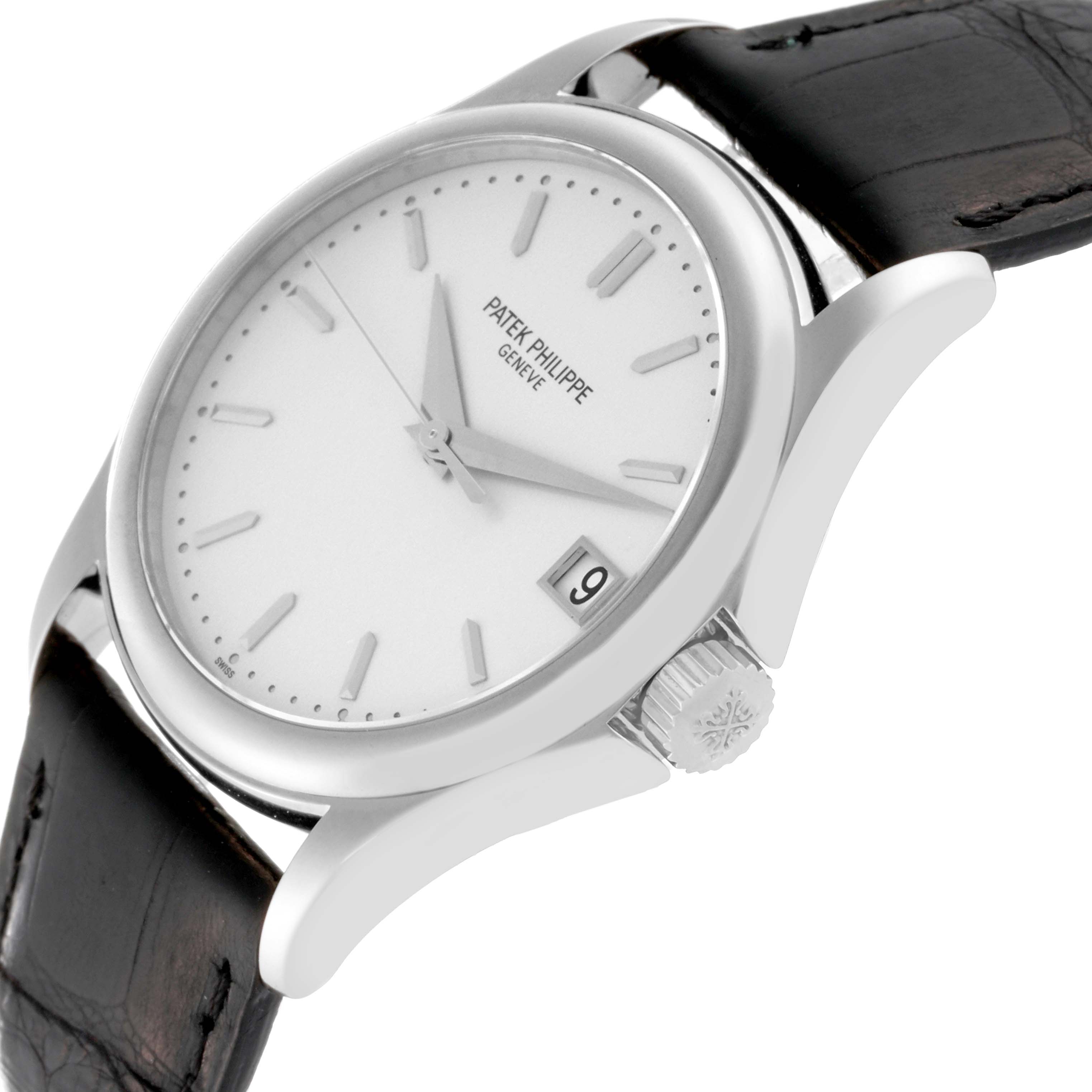 This image shows a side-angle view of the Patek Philippe Calatrava 5127G-001 Men's White Gold Silver Dial 5127G-001 Men's White Gold Silver Dial watch, highlighting its face, crown, and leather strap.