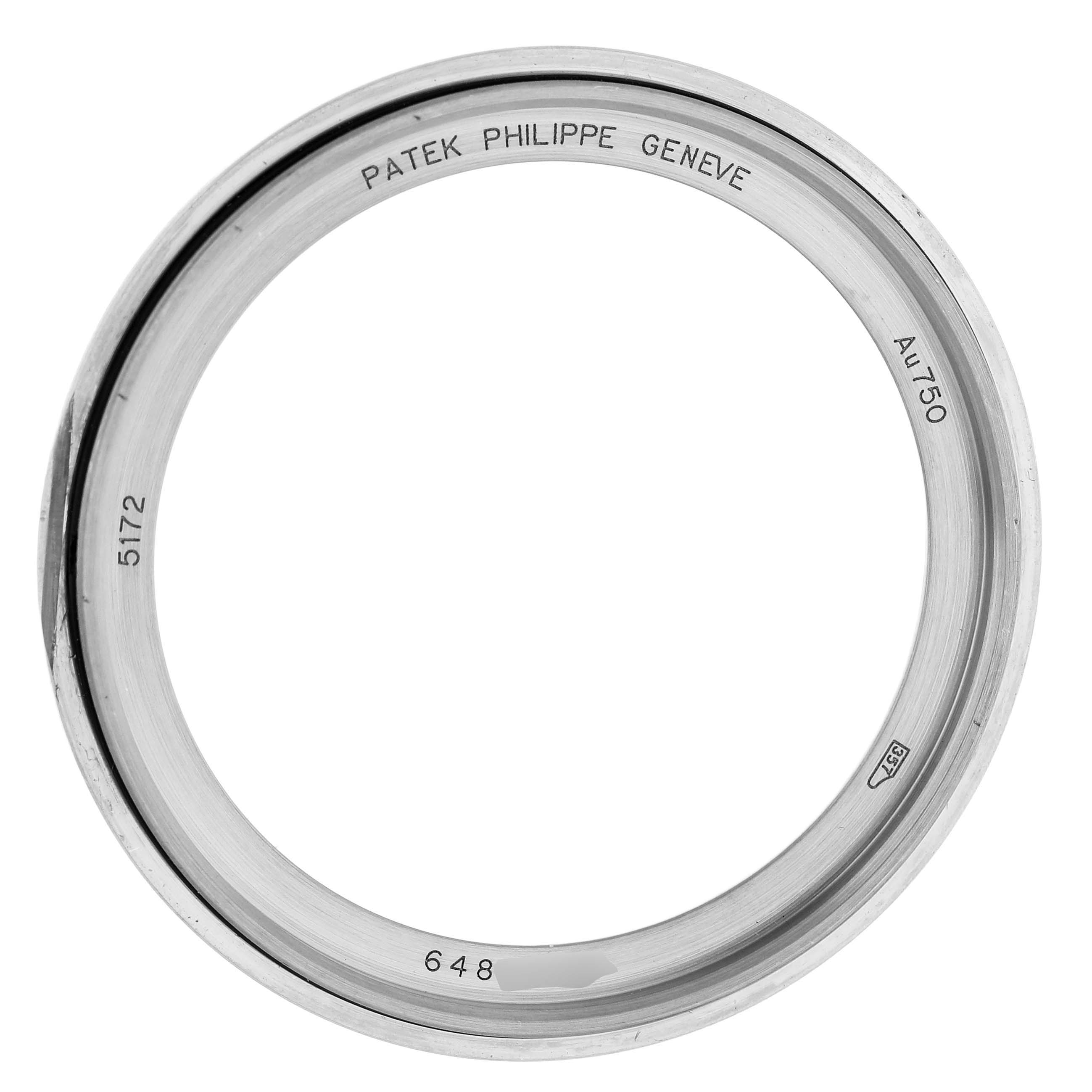 The image shows the bezel of a Patek Philippe Complications 5172G-001 Men's White Gold Blue Dial watch, viewed from the side with engravings visible on the inner edge.