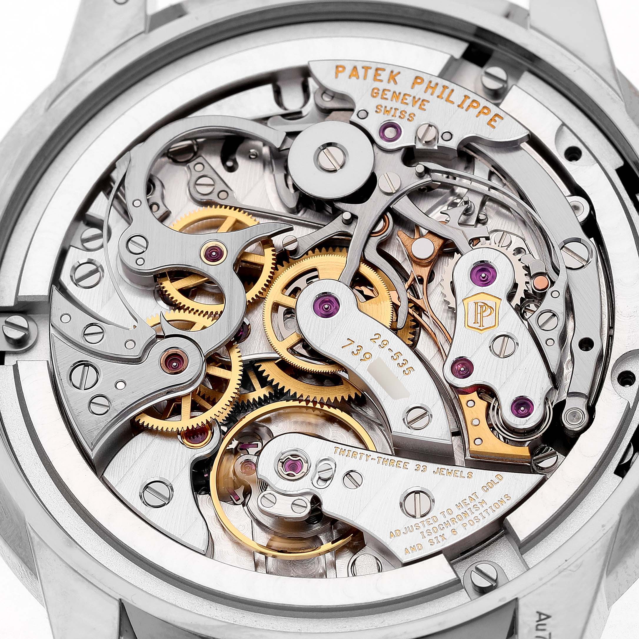 The image shows the intricate movement and gears from the back of a Patek Philippe Complications 5172G-001 Men's White Gold Blue Dial watch.